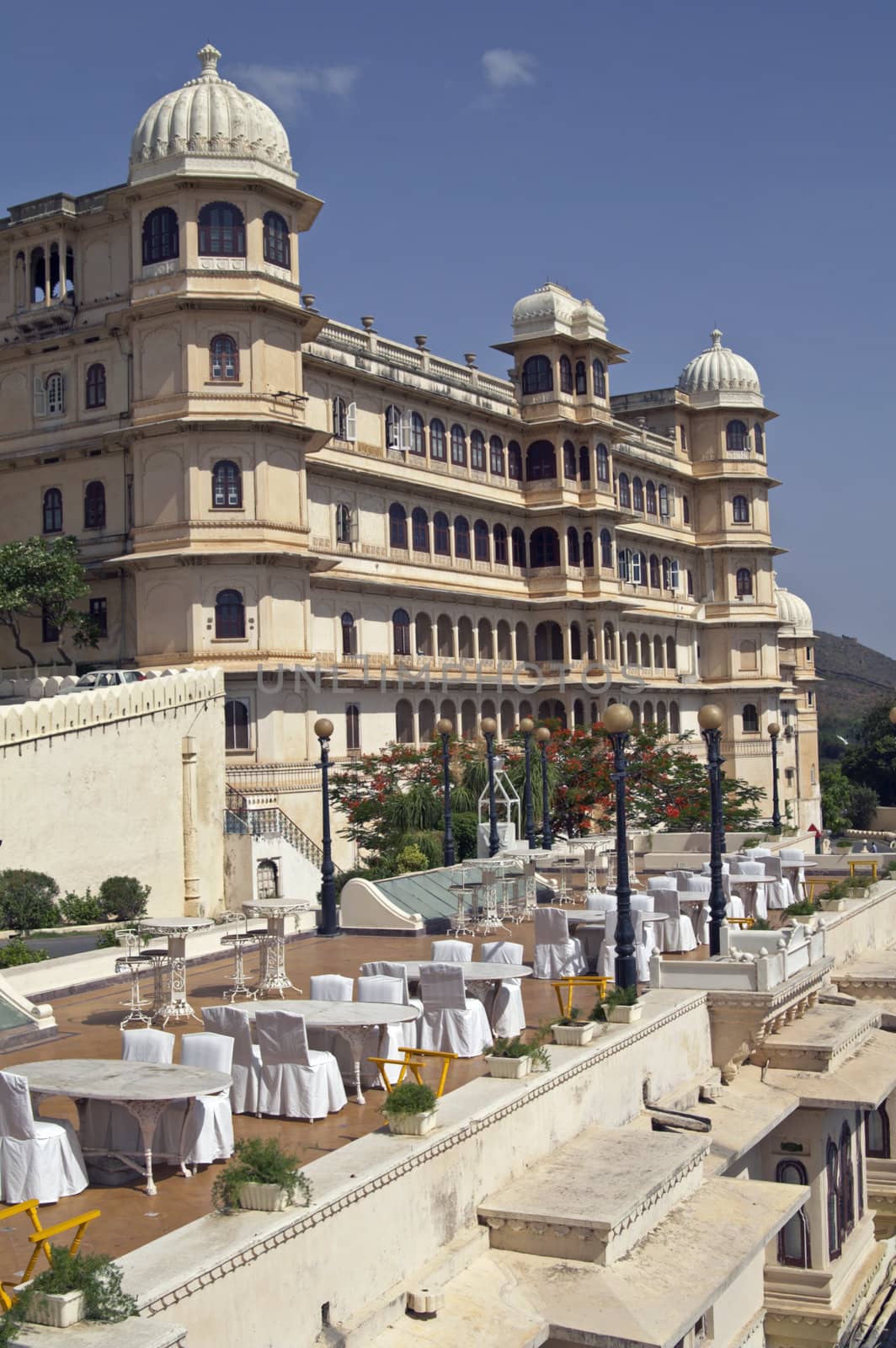 Open air restaurant and Rajput style palace (now a luxury hotel). Udaipur, Rajasthan, India.