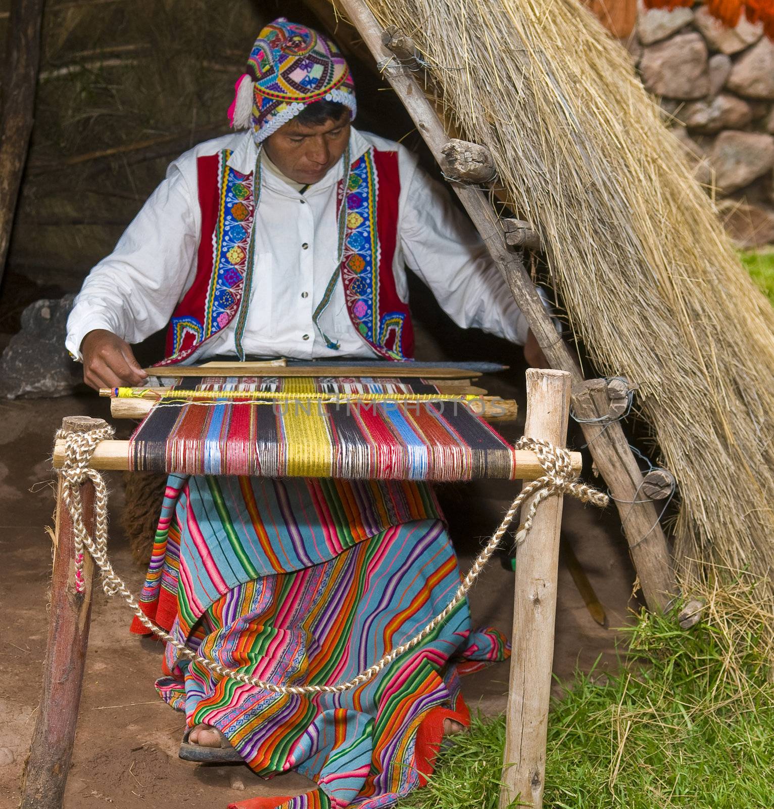 Cusco , Peru - May 26 2011 : Quechua Indian woman weaving with strap loom