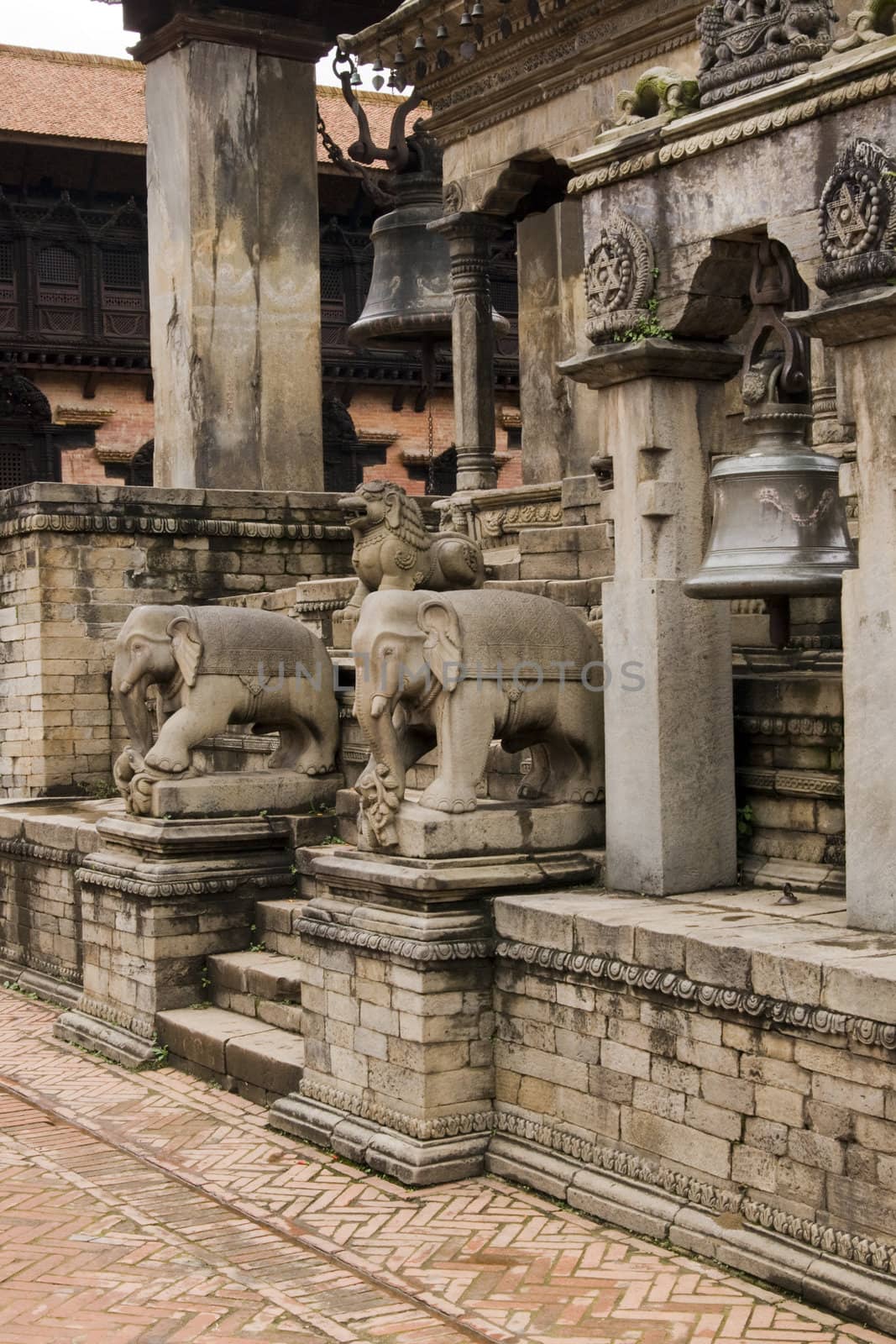 Statues of mythical beasts guarding the steps of an ancient Hindu Temple in the Durbar Square, Bhaktapur, Nepal