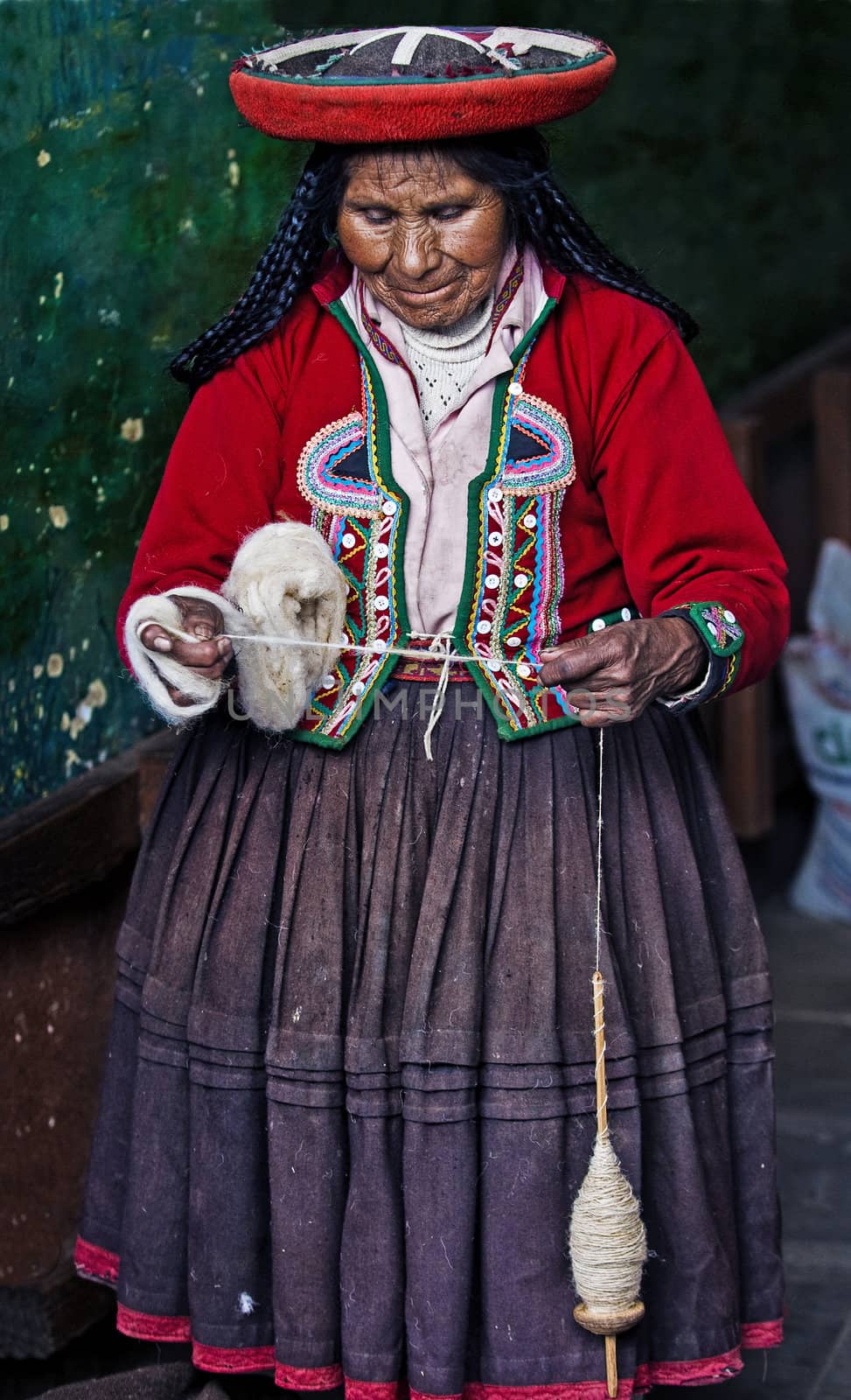 Cusco , Peru - May 26 2011 : Quechua Indian woman weaving 