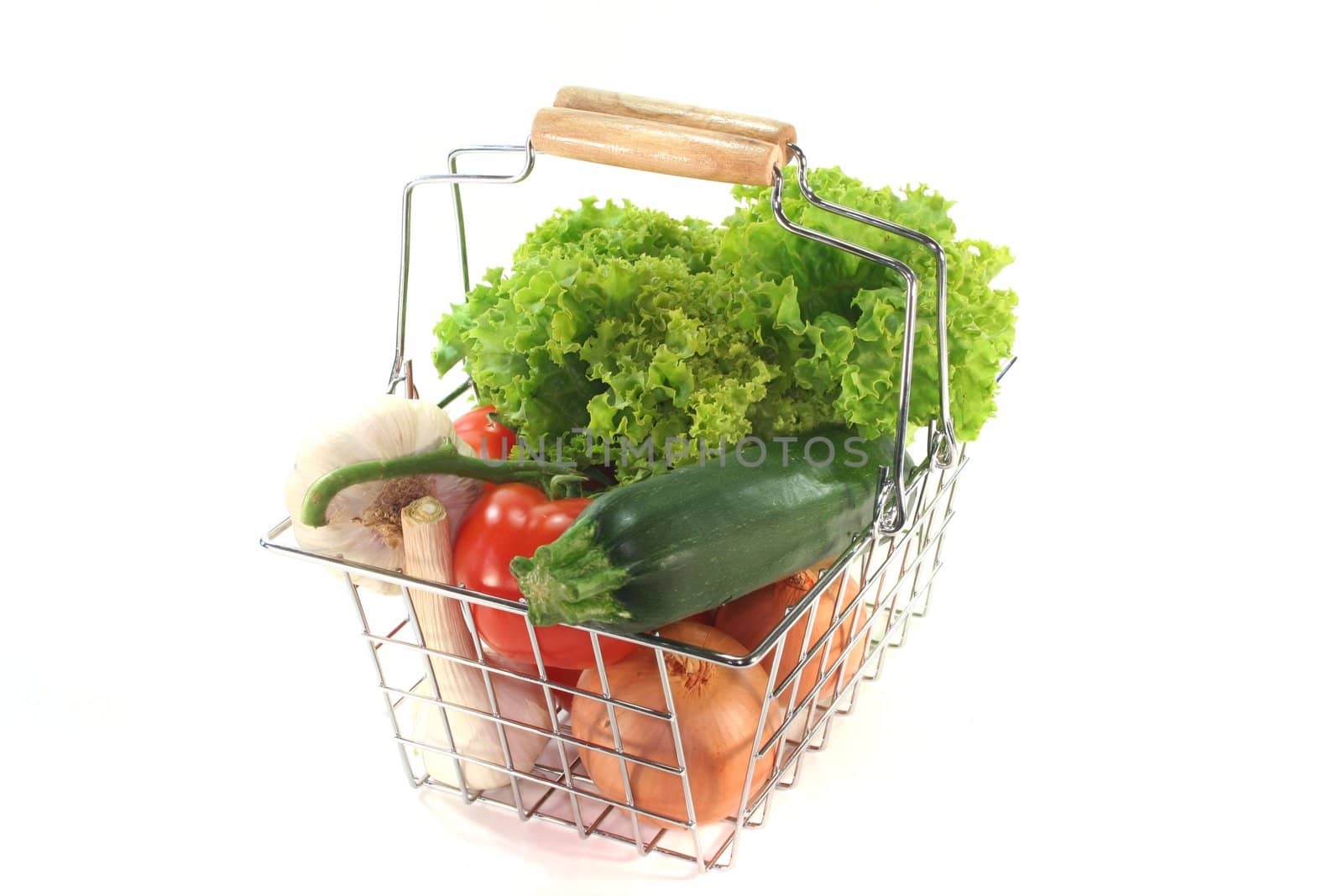 Colorful mixture of vegetables in the Shopping basket on a white background