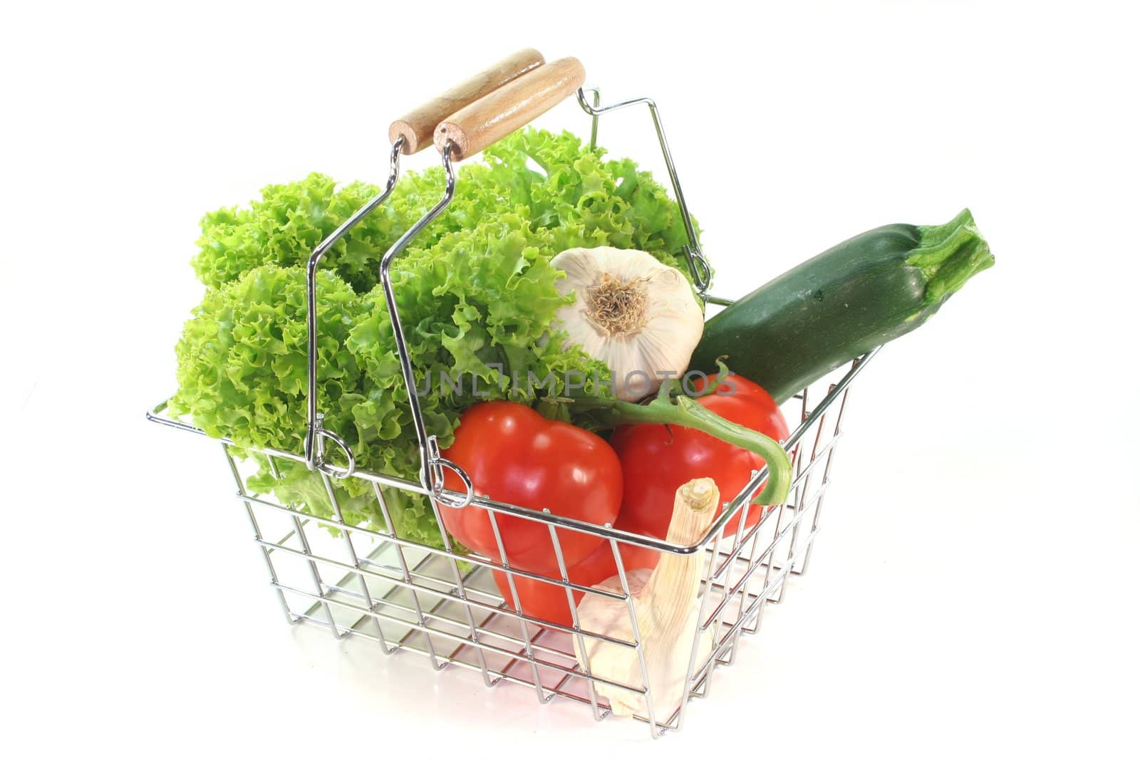 Colorful mixture of vegetables in the Shopping basket on a white background