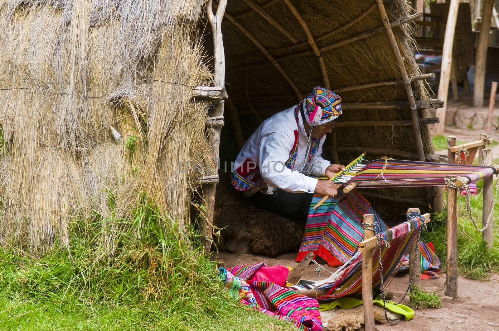 Peruvian man weaving by kobby_dagan
