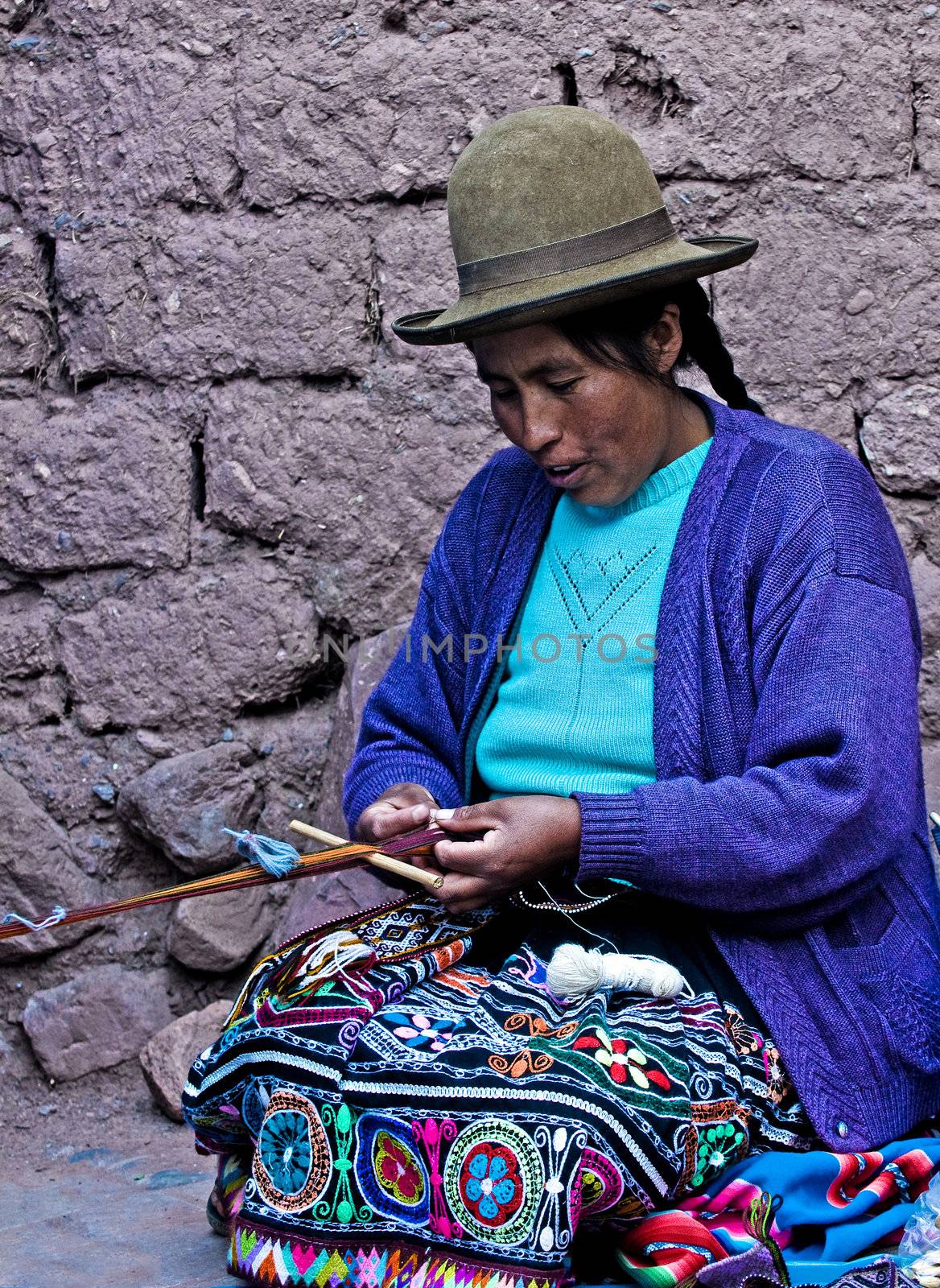 Cusco , Peru - May 26 2011 : Quechua Indian woman weaving with strap loom