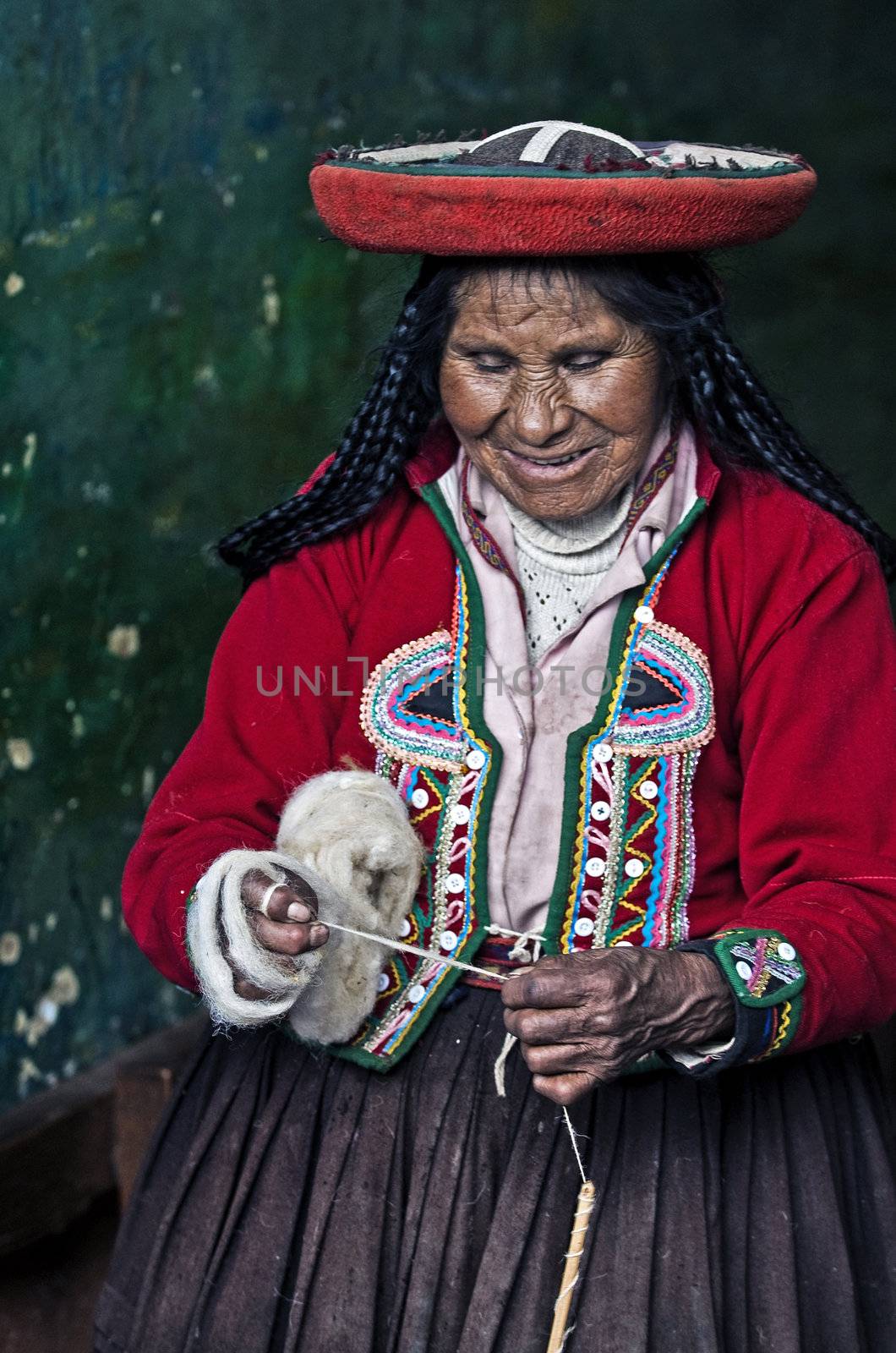 Cusco , Peru - May 26 2011 : Quechua Indian woman weaving with strap loom