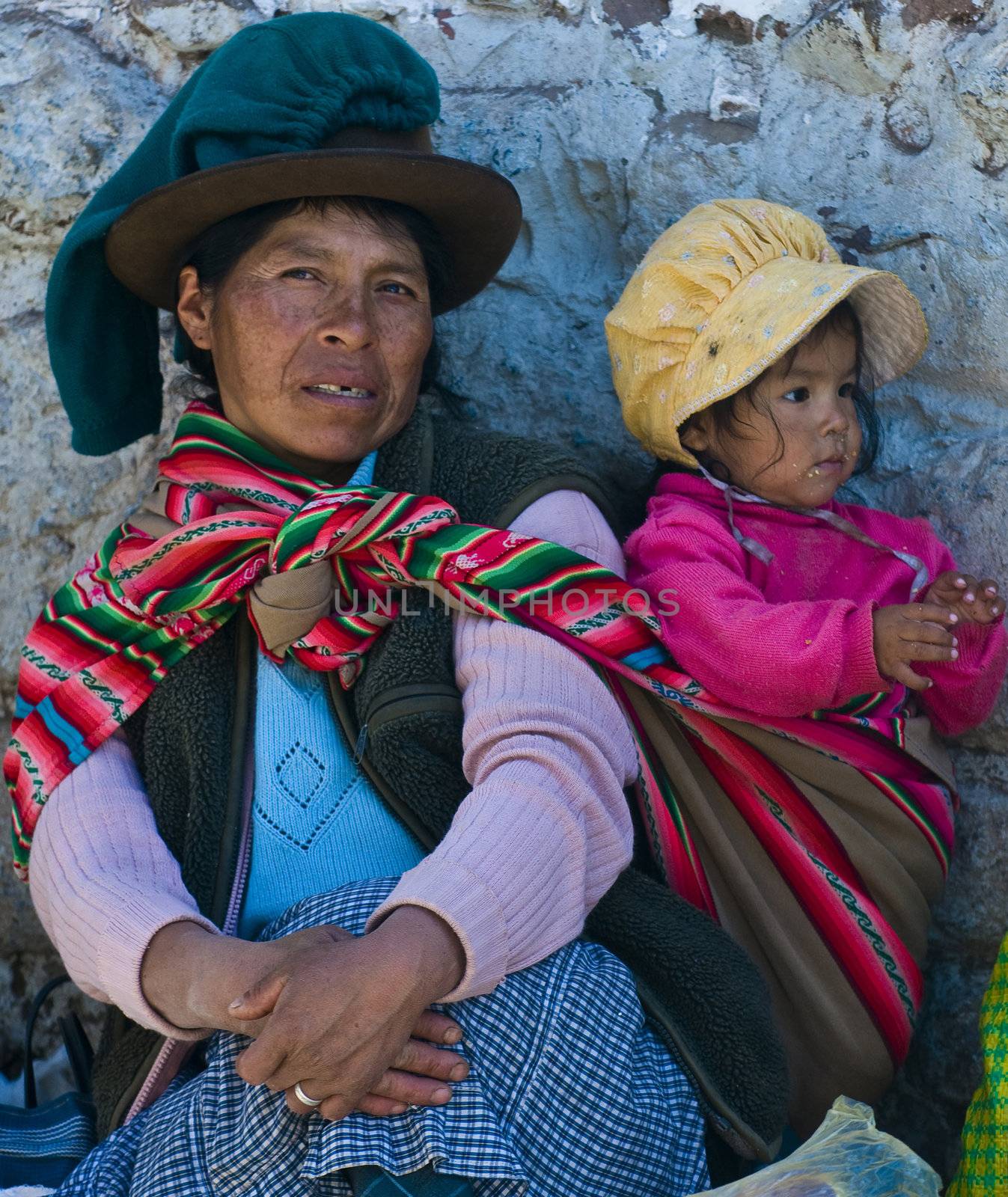 Cusco , Peru - May 28 2011 : Peruvian woman with here child in a market in Cusco Peru