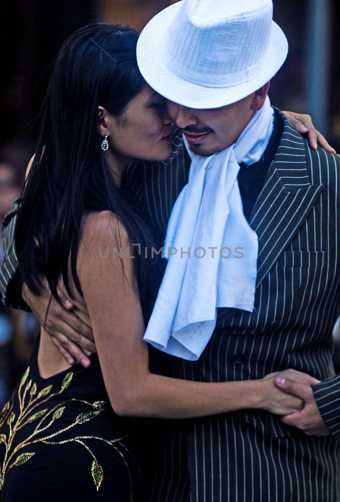 BUENOS AIRES  , ARGENTINA  - APR 24 :  couple dancing tango in the street  ,April 24 2011  in Buenos Aires  Argentina