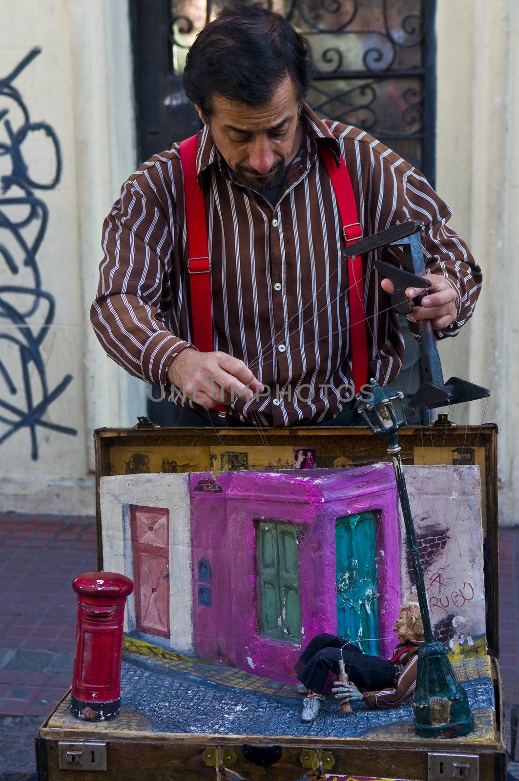 BUENOS AIRES  , ARGENTINA  - APR 24 2011 : Puppeteer in a street puppet show in Buenos aires Argentina  