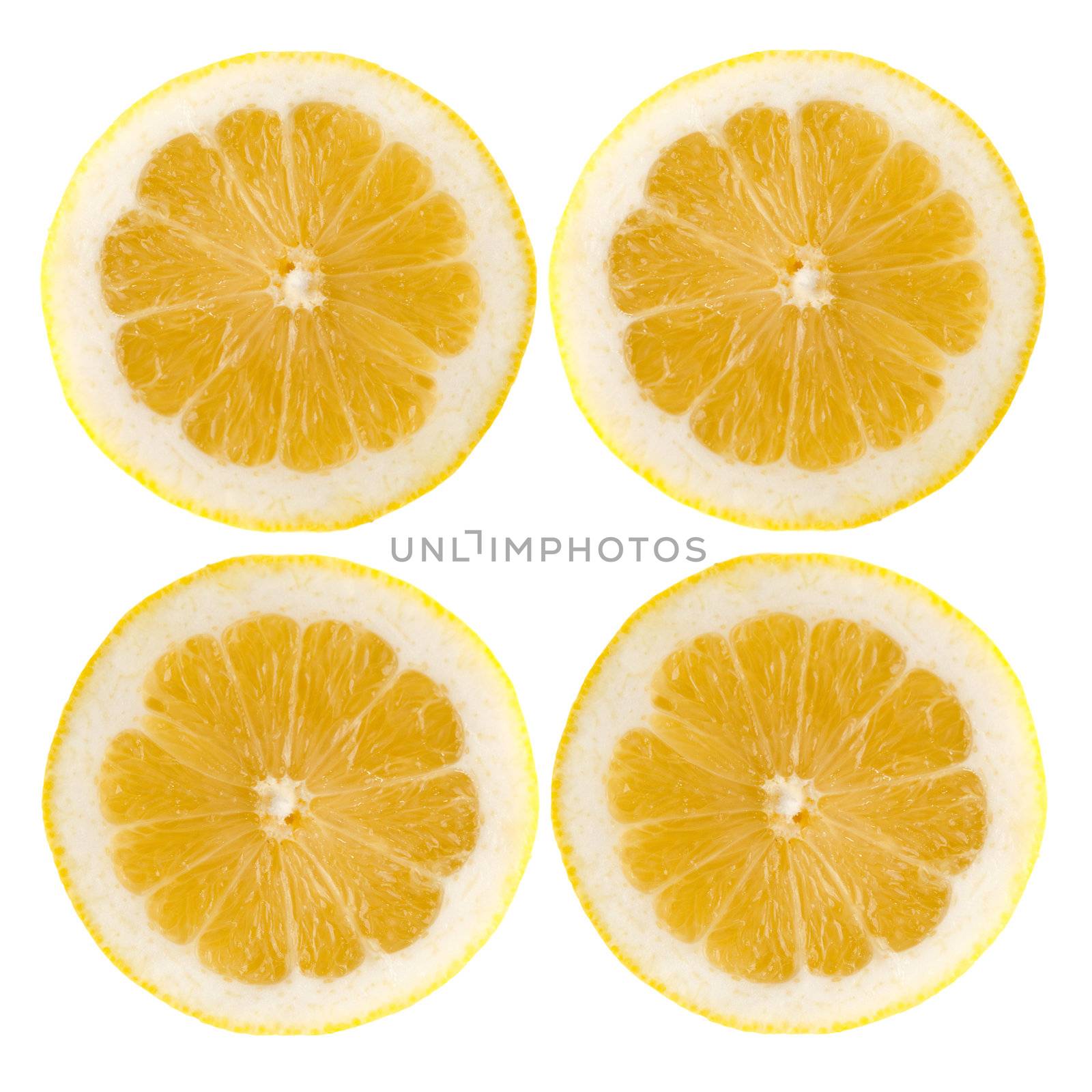 Four fresh lemon halves on white background.