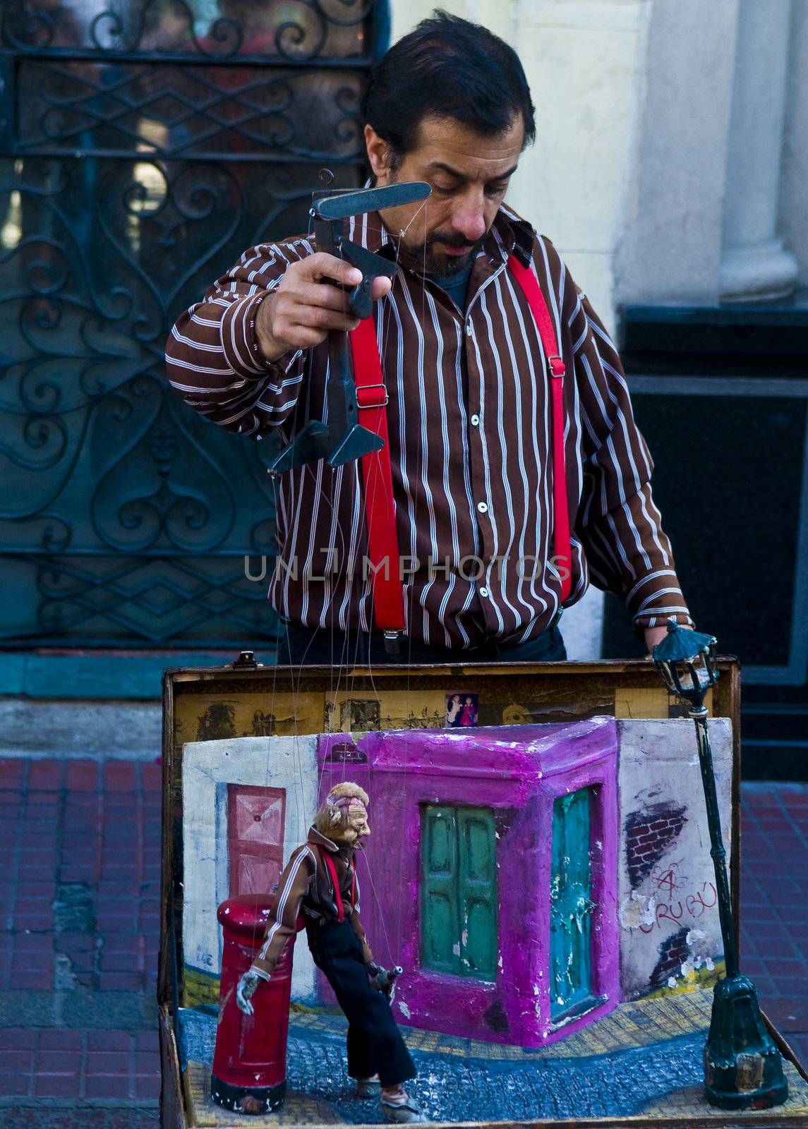 BUENOS AIRES  , ARGENTINA  - APR 24 2011 : Puppeteer in a street puppet show in Buenos aires Argentina  