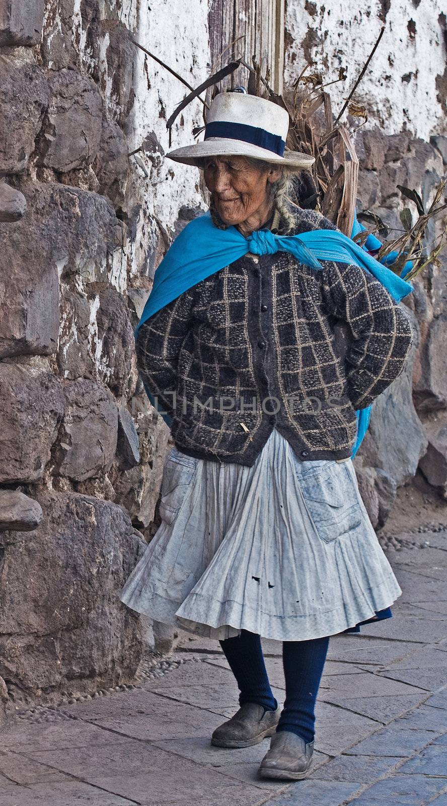 Cusco , Peru - May 26 :  Peruvian woman walk in the narrow alleys of  Cusco Peru 