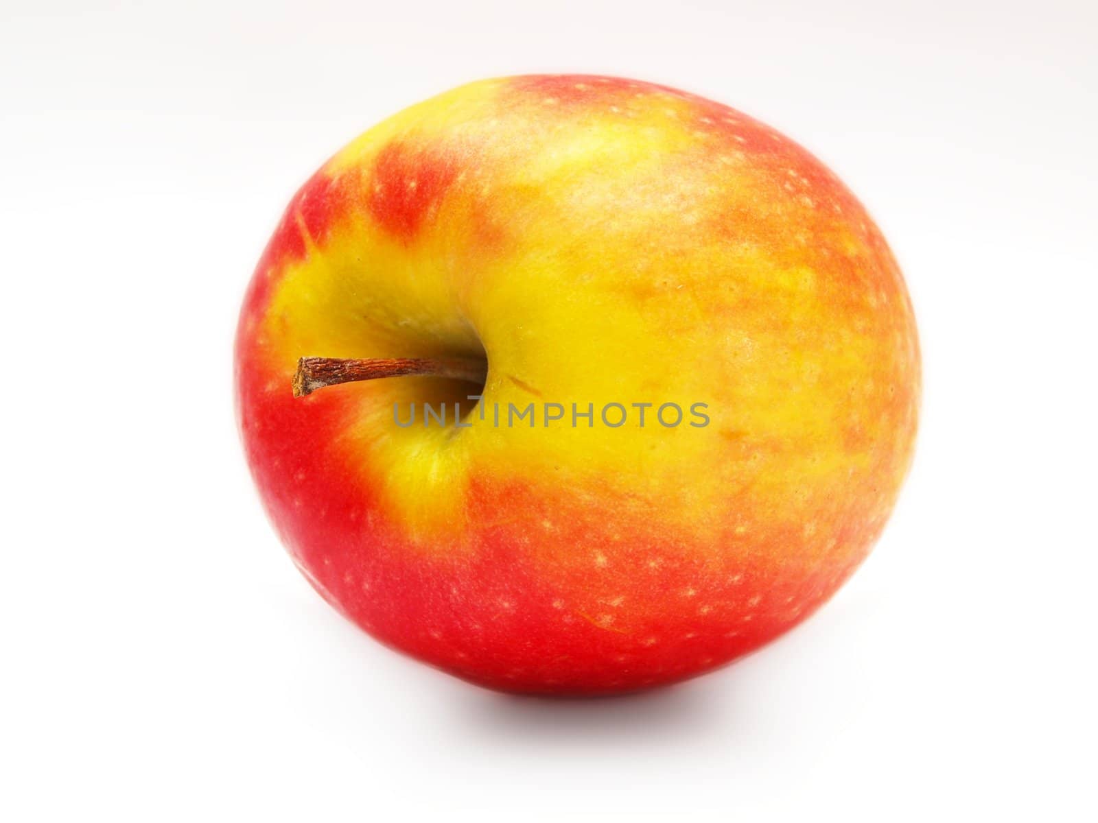 Red and yellowish apple, isolated towards white