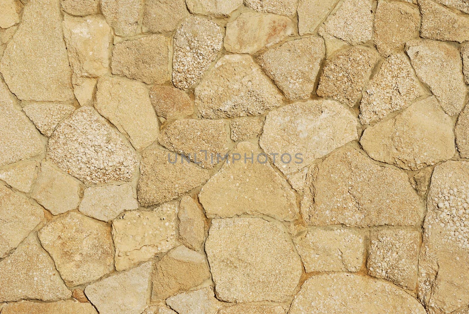 Decorative texture of  sidewalk paved with natural sandstone with varied sand tints