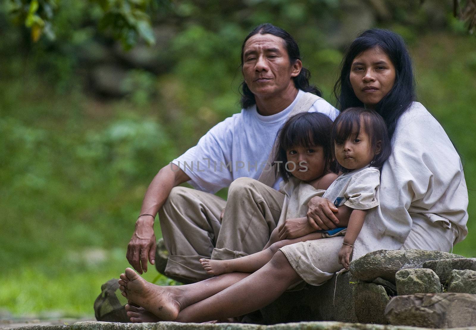 TAYRONA PARK , COLOMBIA - DECEMBER 17 2010 : Indian family sit together at home in a village in "Tayrona" park , Colombia 