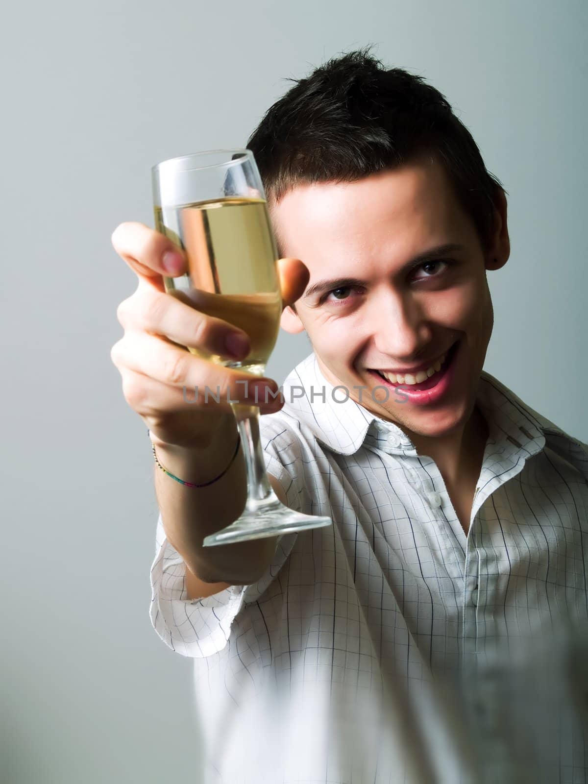 Young man drinking champaign