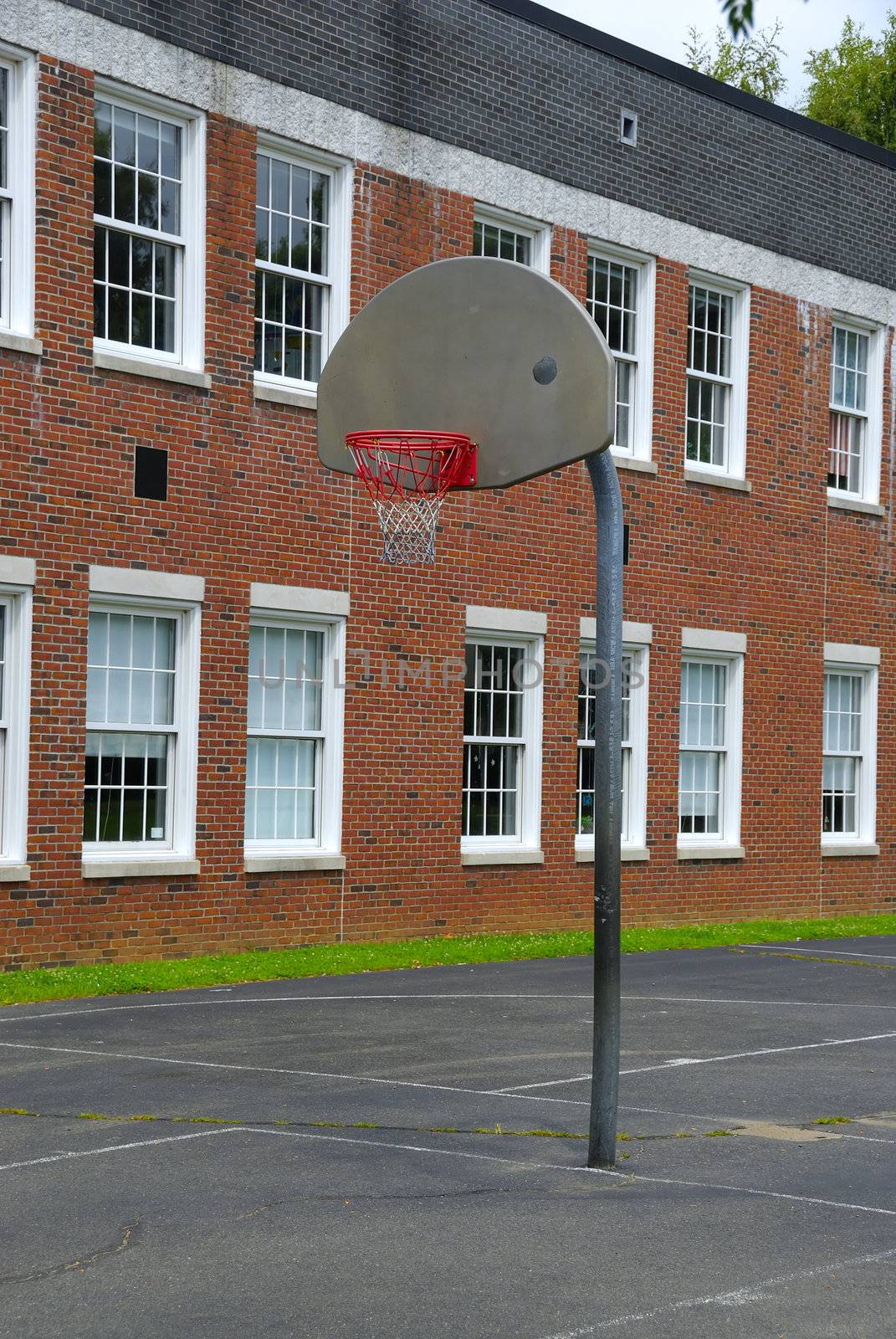 An open basket ball court in an old school