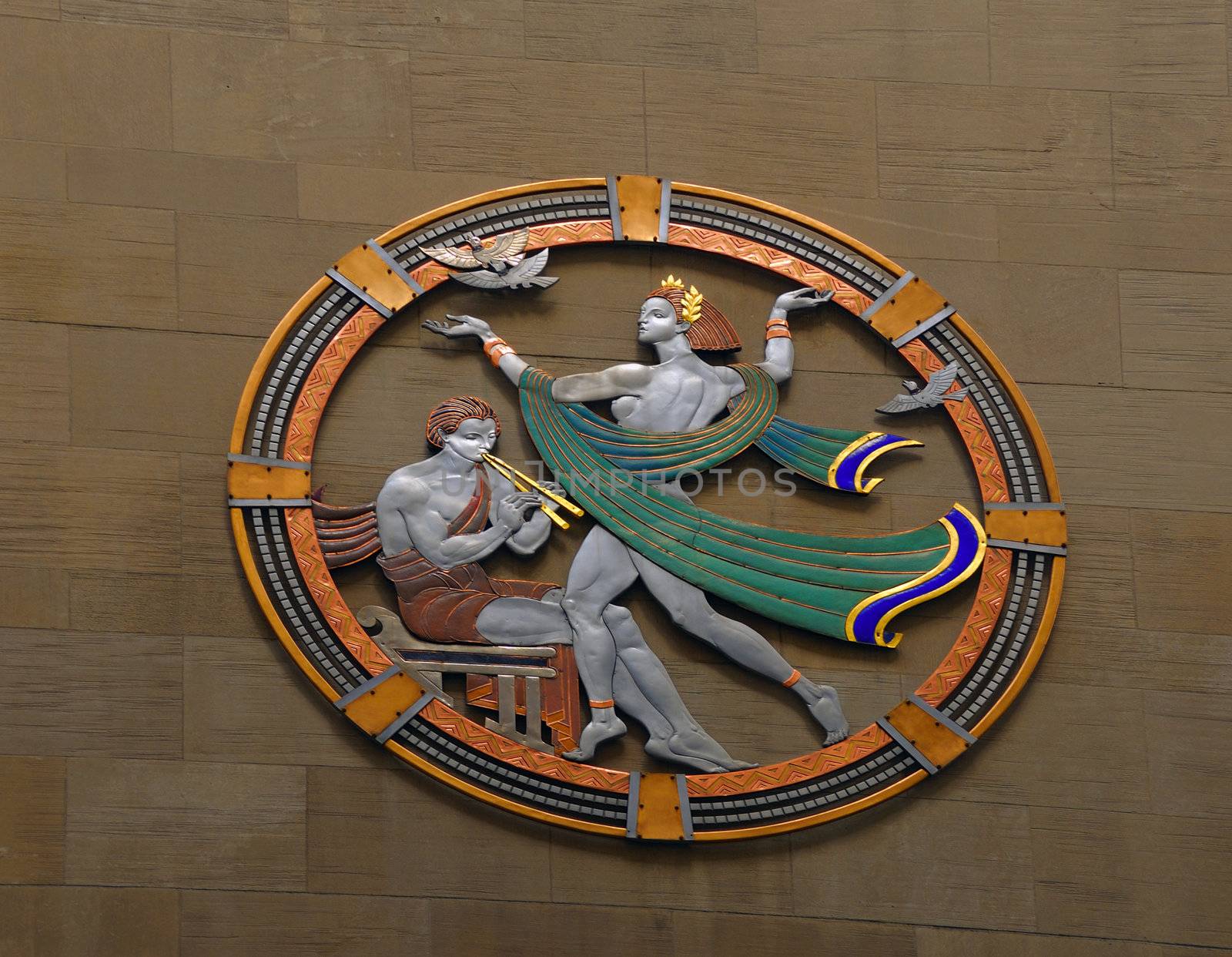 Art Deco frieze on a granite wall at Rockefeller Center in New York City.