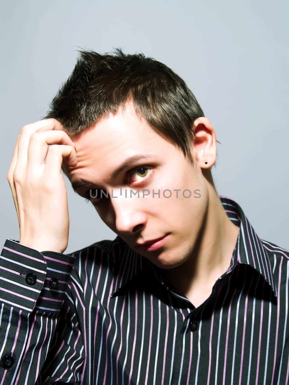 Portrait of a young man thinking