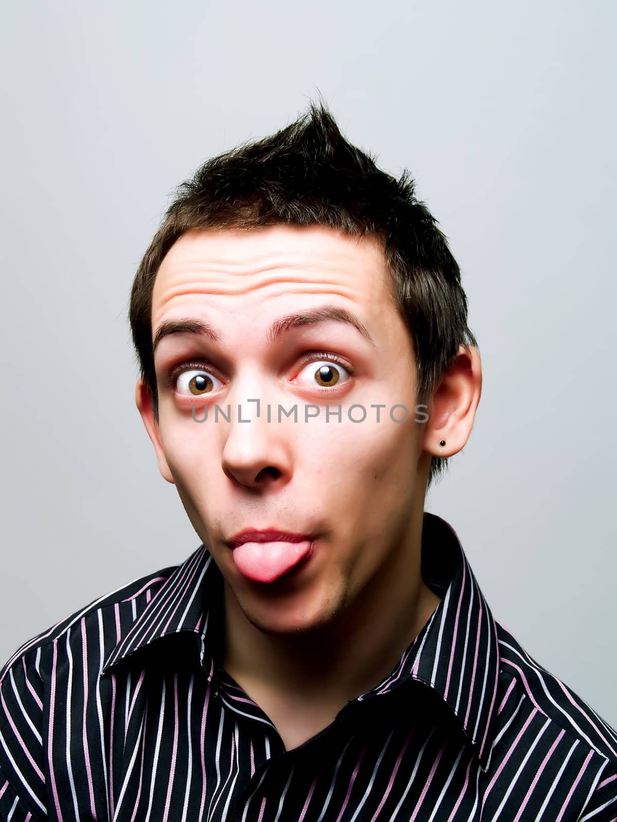 Portrait of a young man having fun