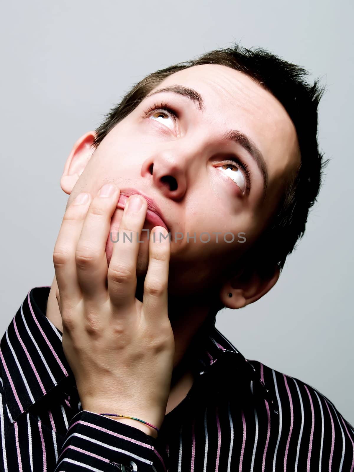 Portrait of a young man looking up