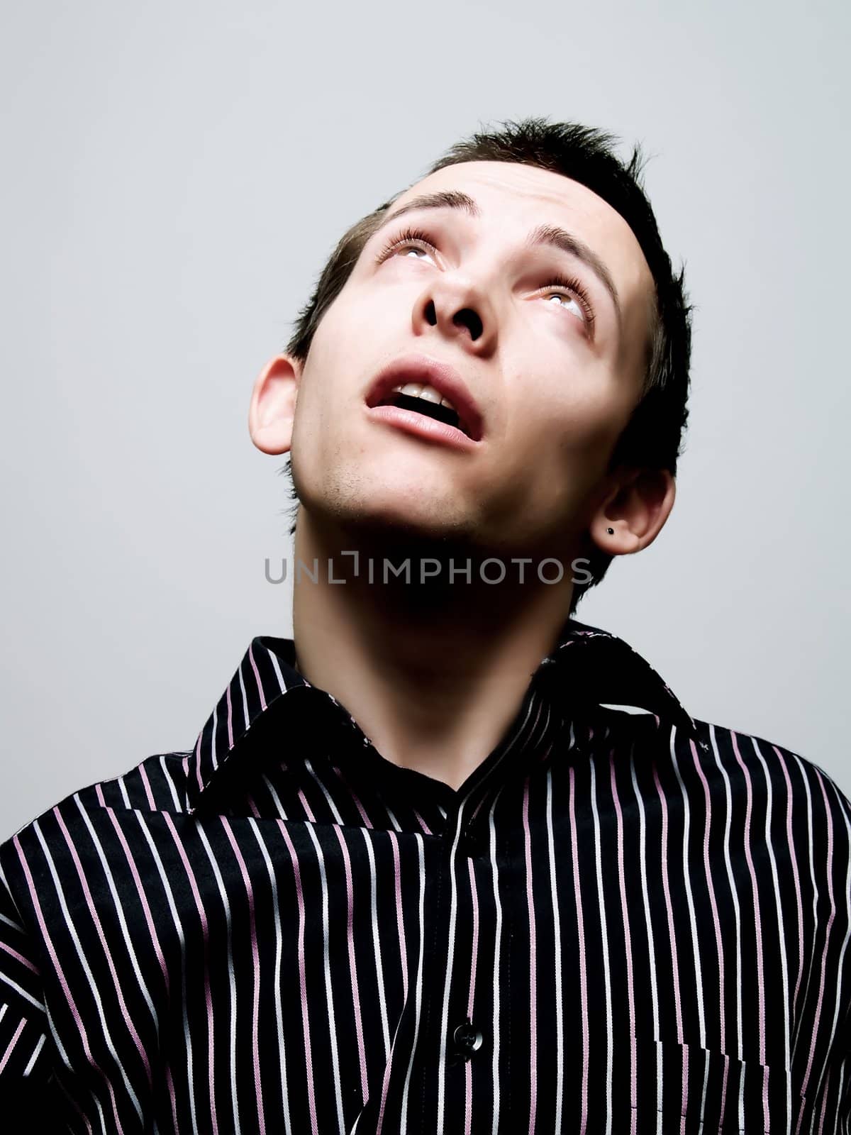 Portrait of a young man looking up