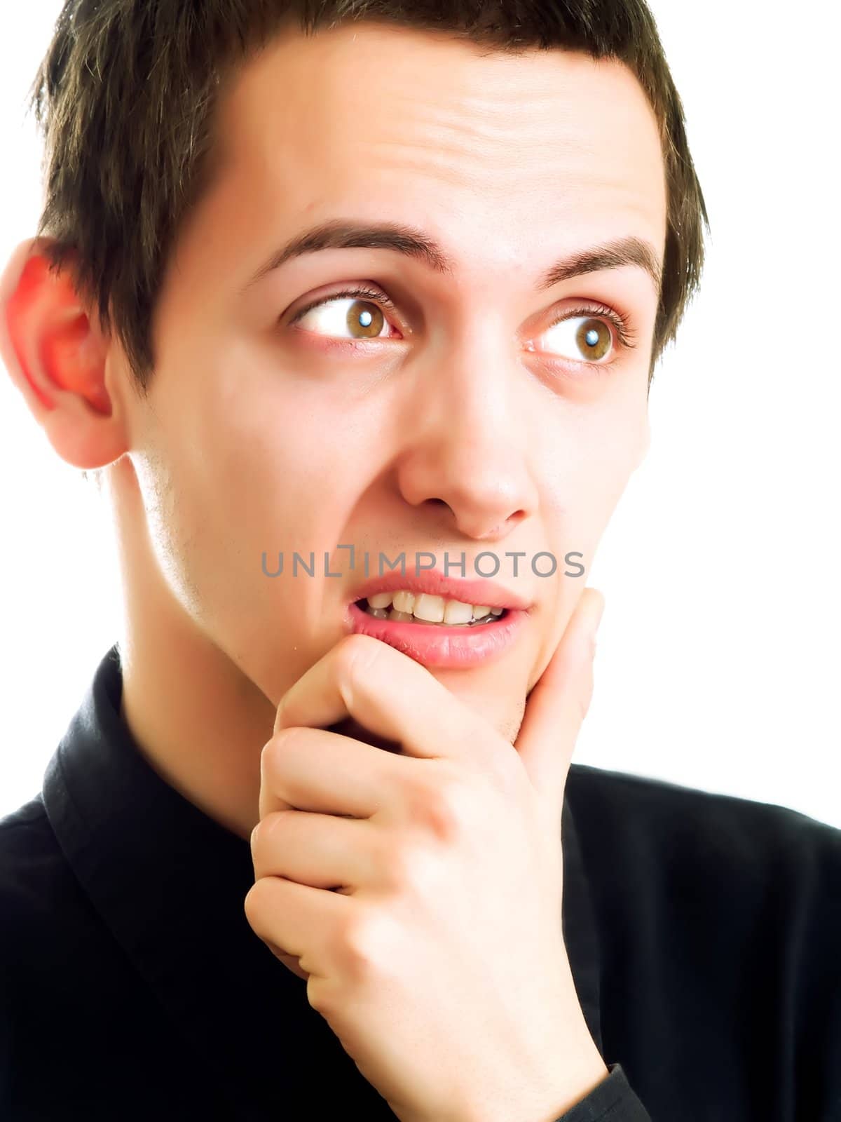 Young man smiling over a white background