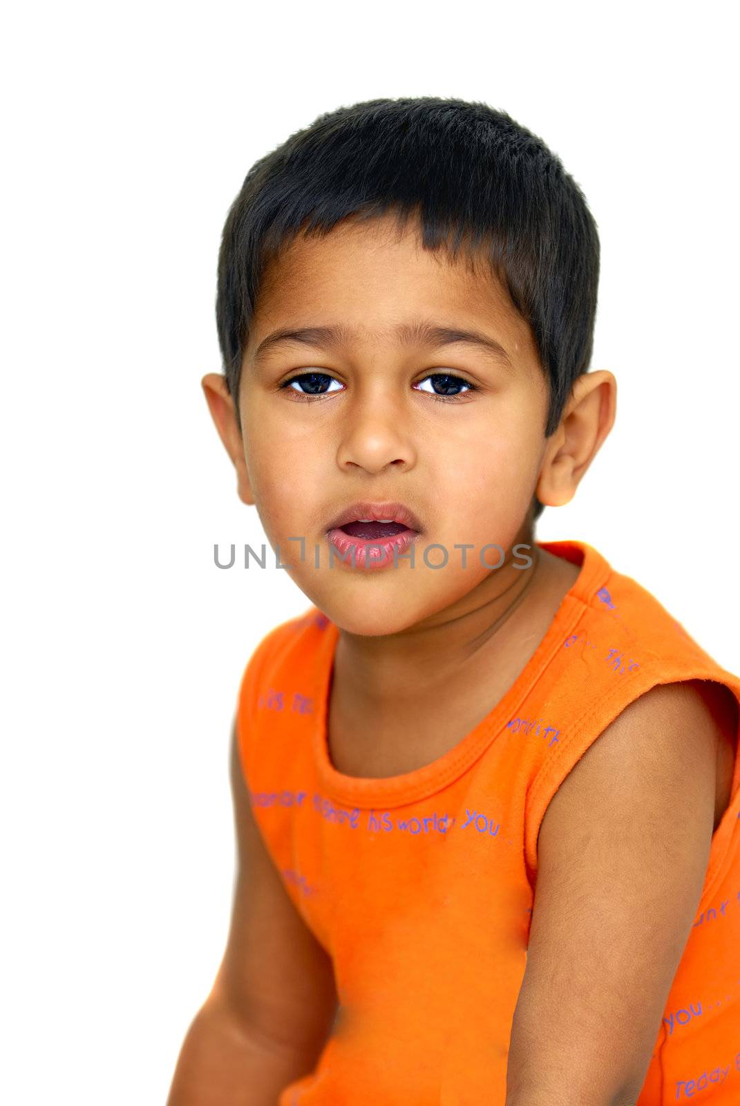 an handsome Indian kid not looking happy