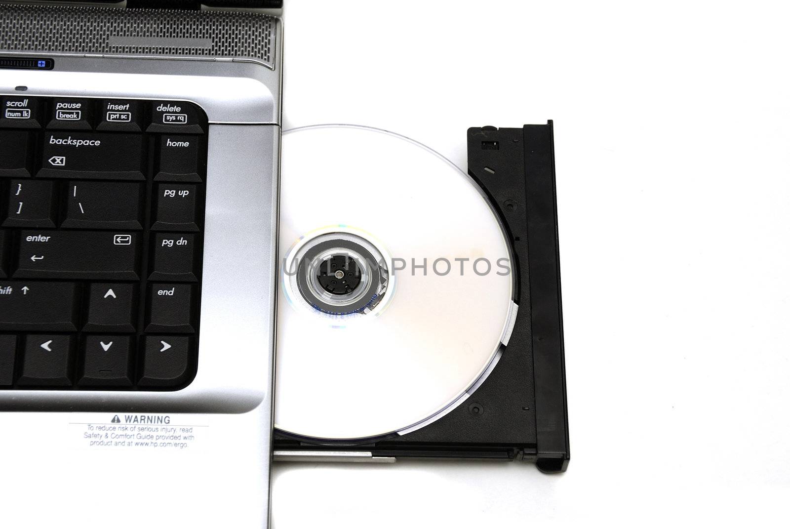 Open laptop CD-ROM drive on a white background

