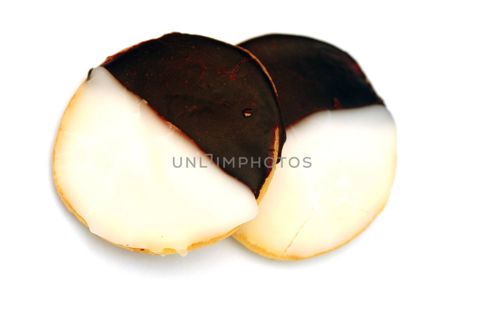 Two blak and white cookies isolated on a white back ground