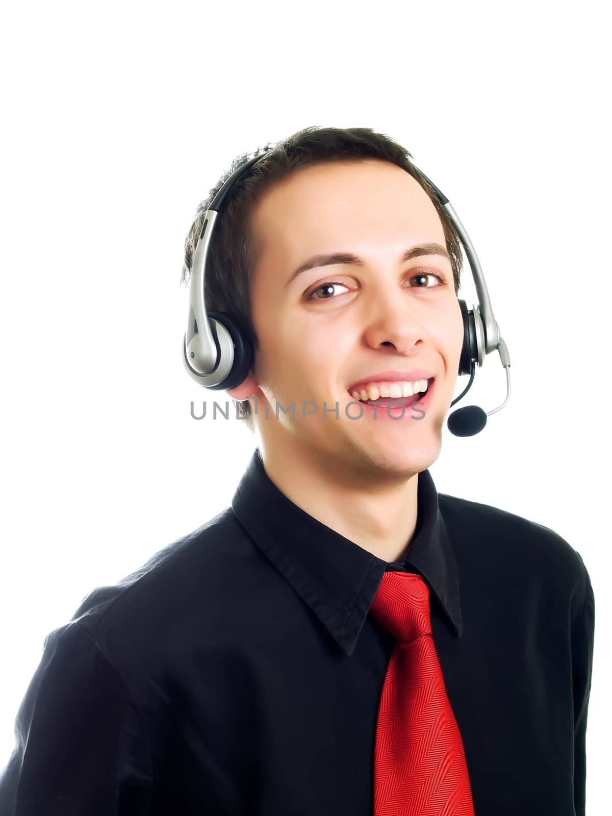 Young man calling with a haeadset and smiling