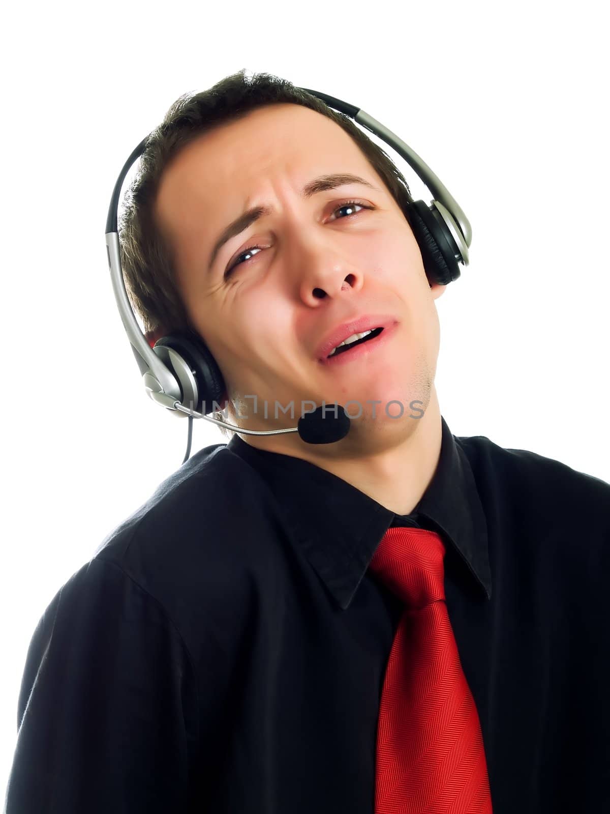 Young man calling with a haeadset and smiling