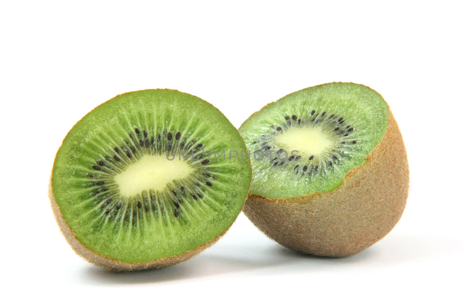 kiwi fruit cuted in two halfs isolated on white background healthy eating and agriculture concepts