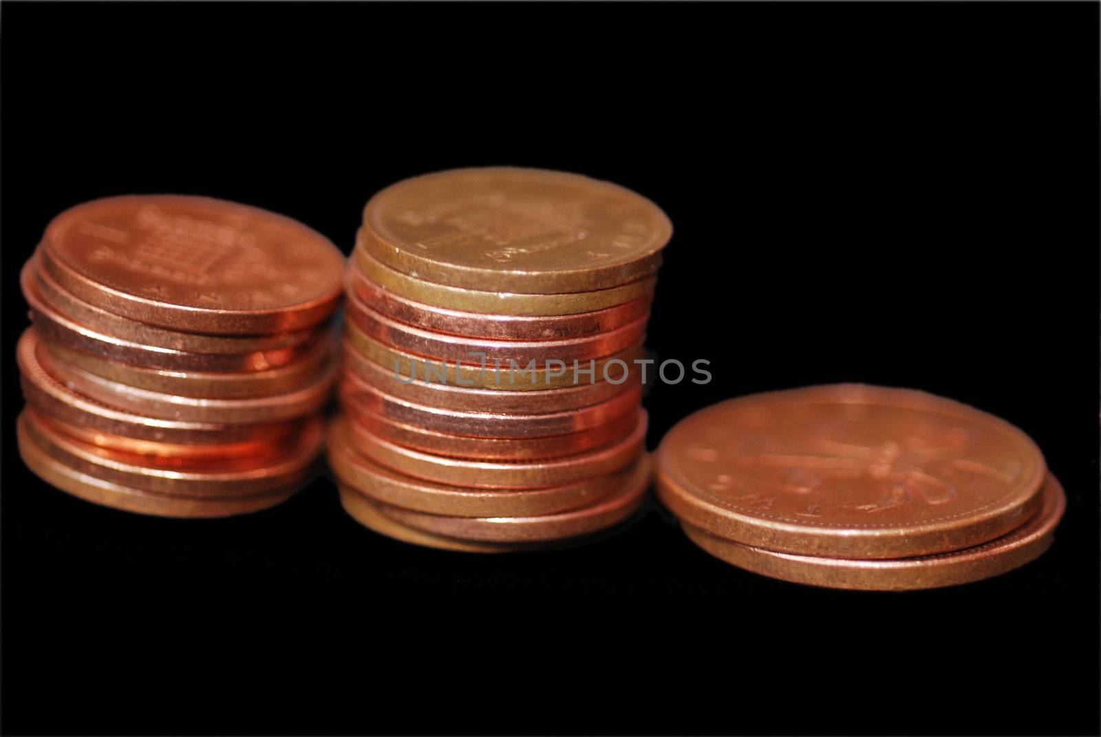 Piles of 1 pence and 2 pence pieces