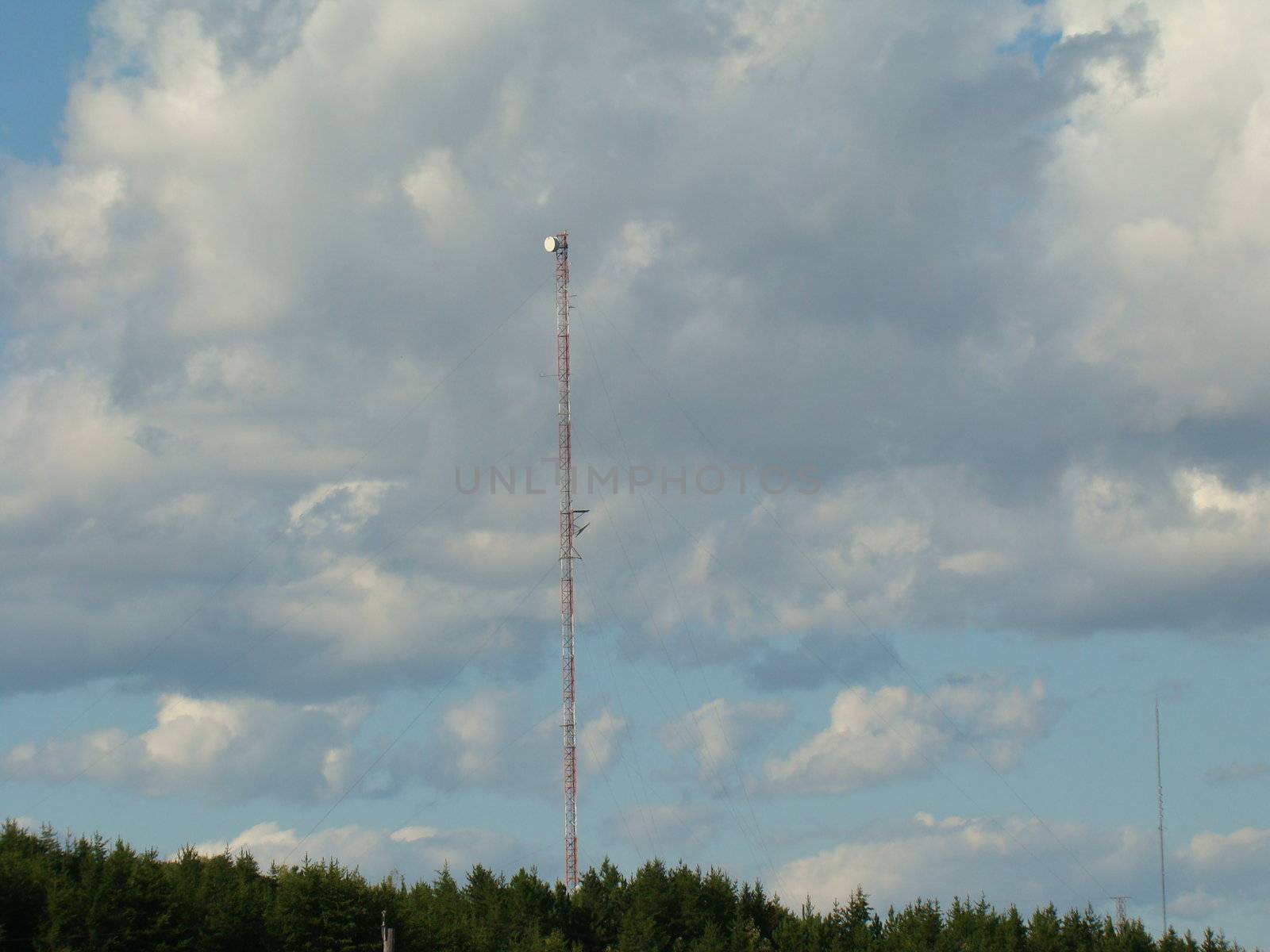 communication tower against blue sky by hicster