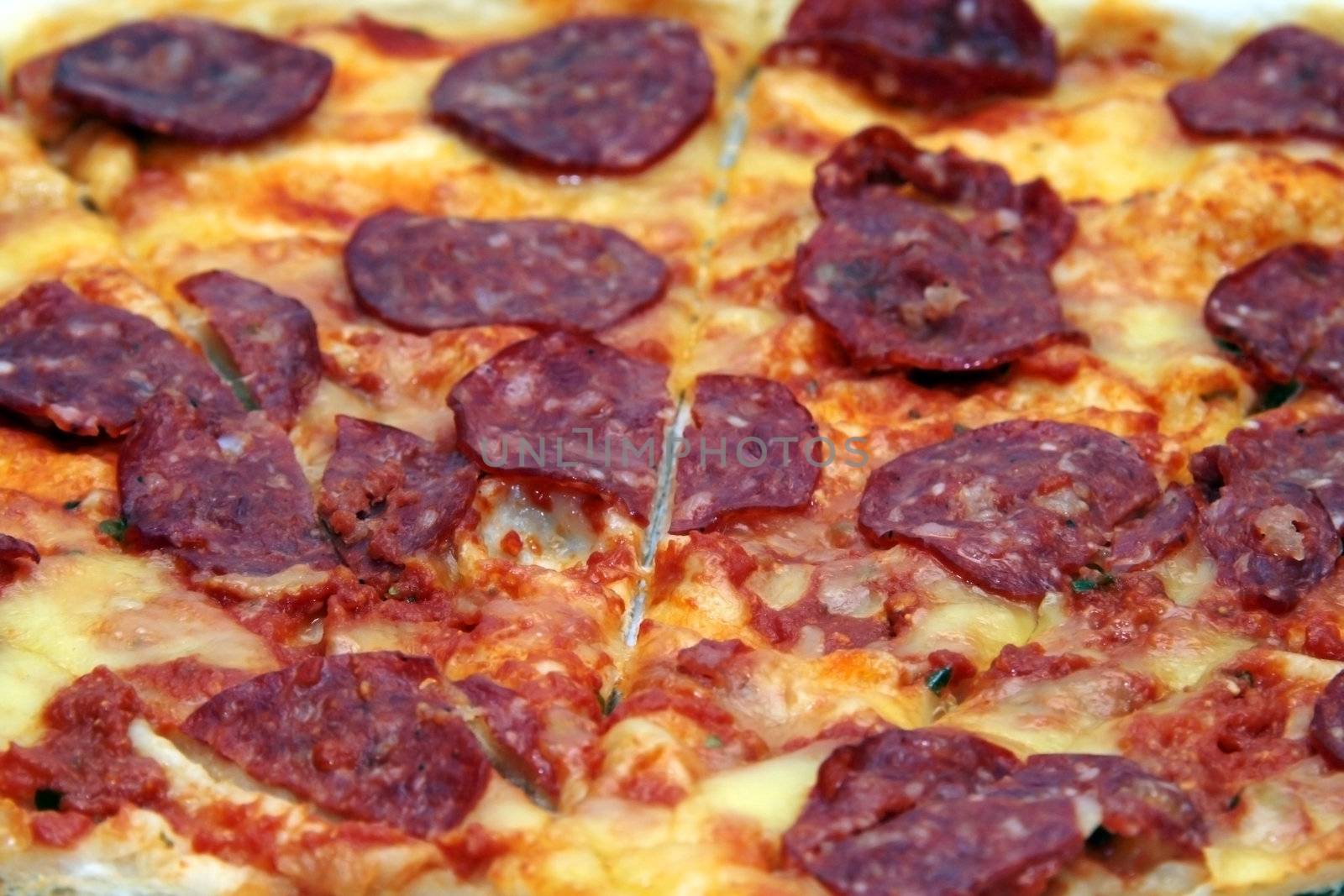close up shot of a pepperoni flavored pizza
