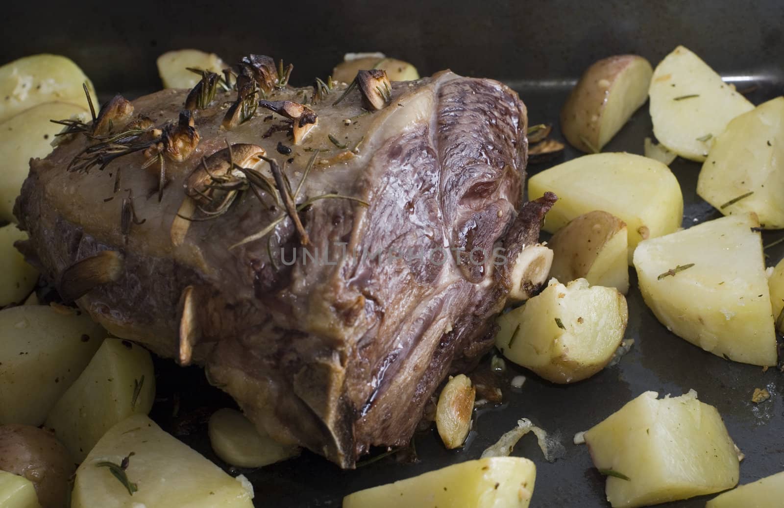 a lamb shank and roast potatos