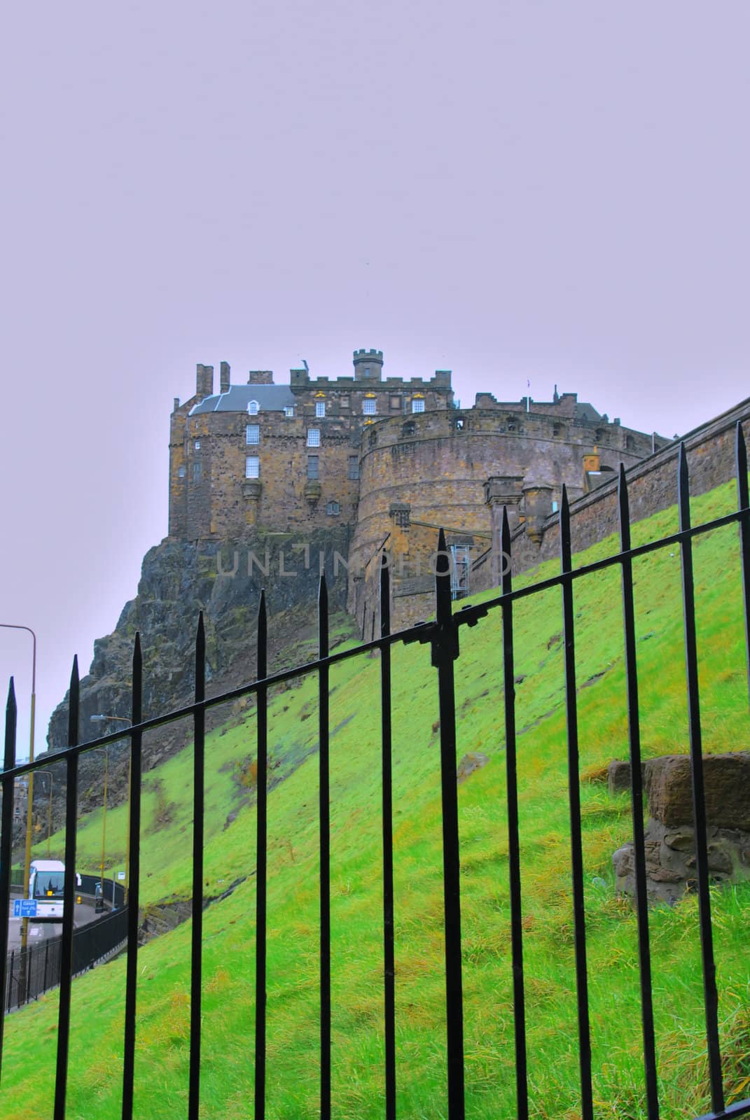 Edinburgh castle hidden behind the fence.