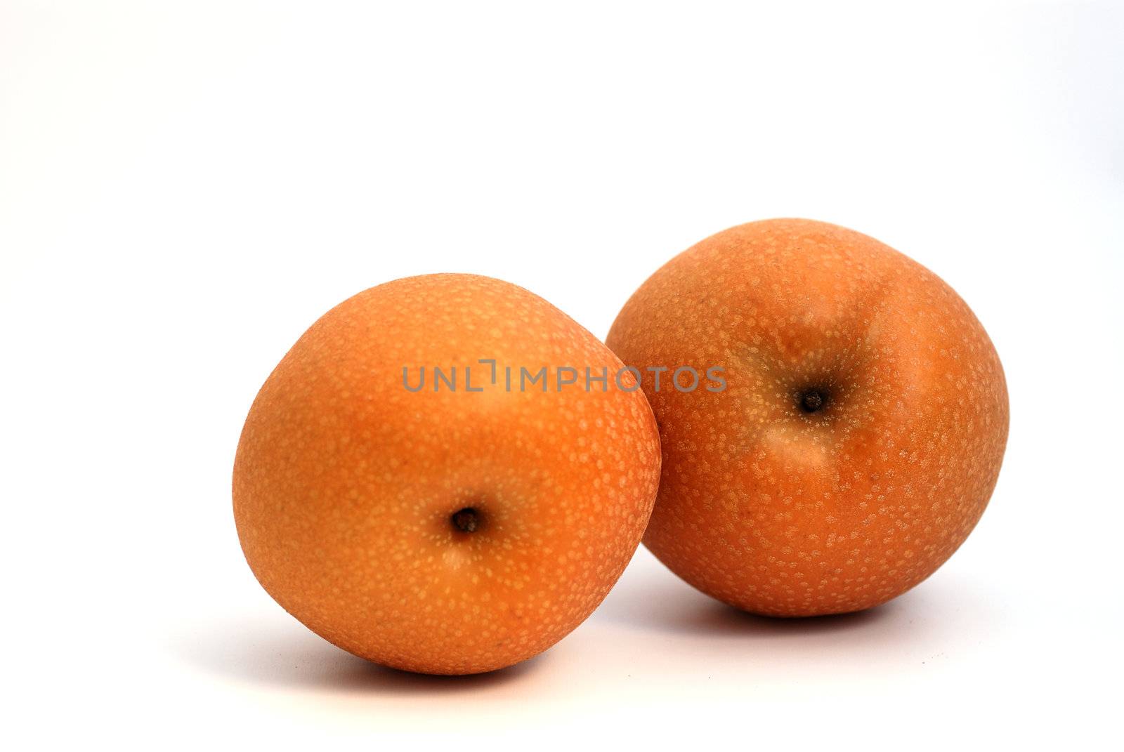 Two Japanese pears on white background