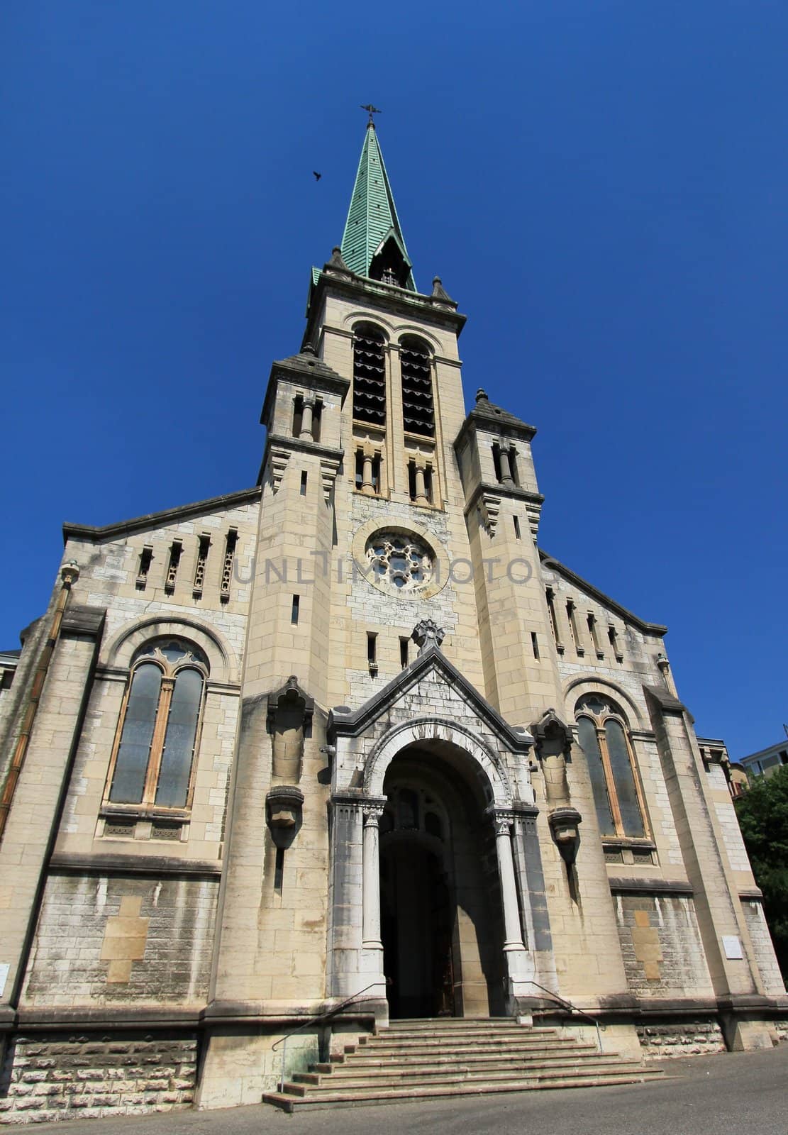 Facade of old Notre-Dame church at Aix-les-Bains, France, by beautiful weather