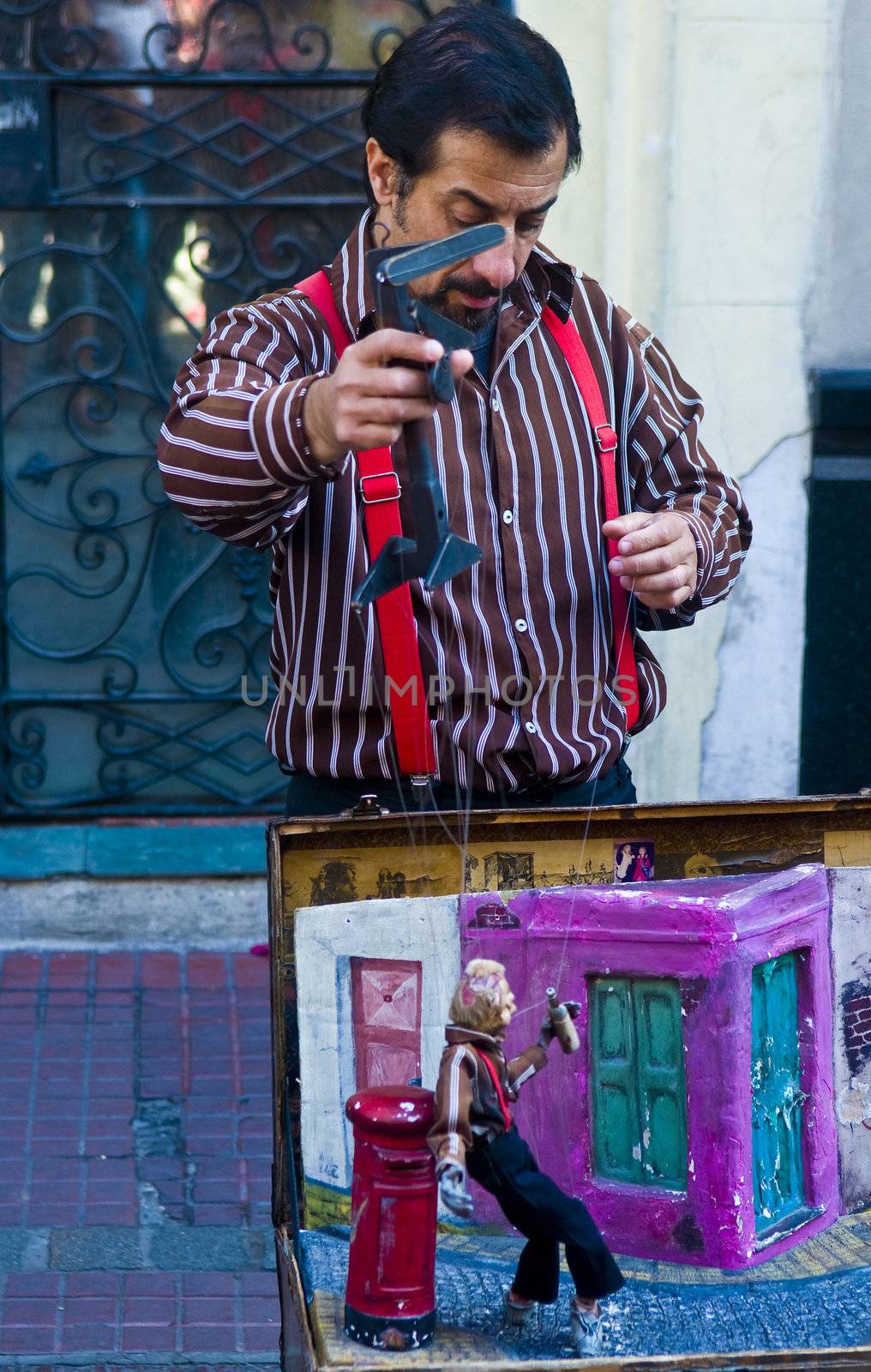 BUENOS AIRES  , ARGENTINA  - APR 24 2011 : Puppeteer in a street puppet show in Buenos aires Argentina  