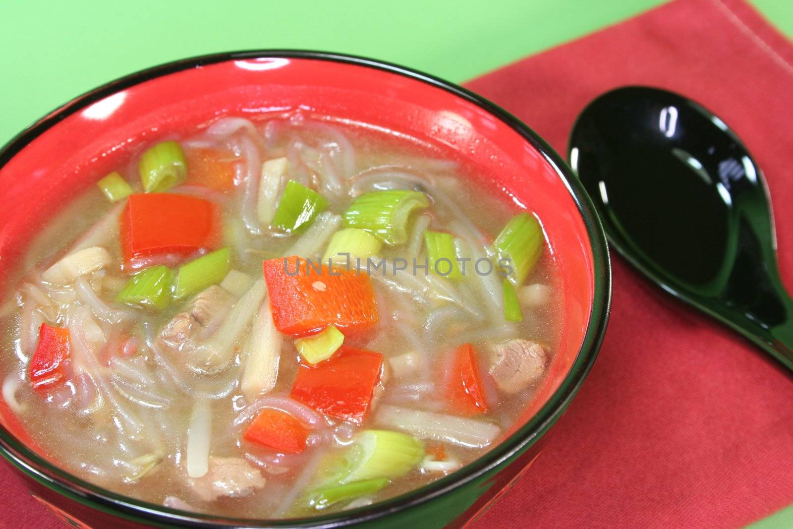 sour spicy Thai soup with glass noodles, chicken, bamboo shoots and peppers