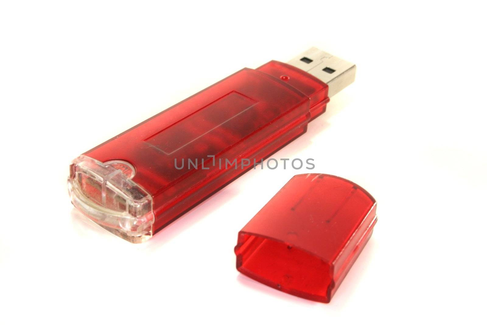 open red USB stick on a white background