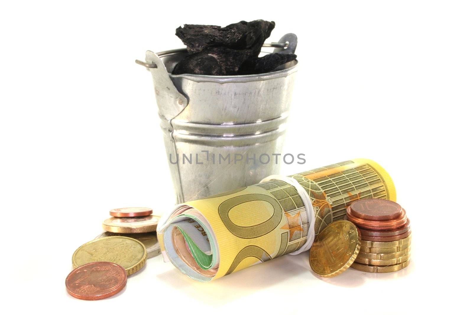 Bucket of coal and euro notes on a white background