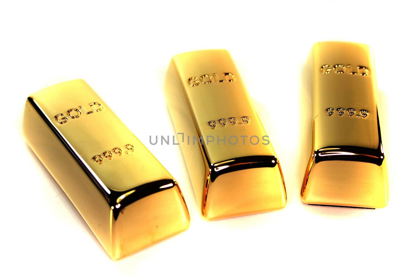 three large gold bars on a white background