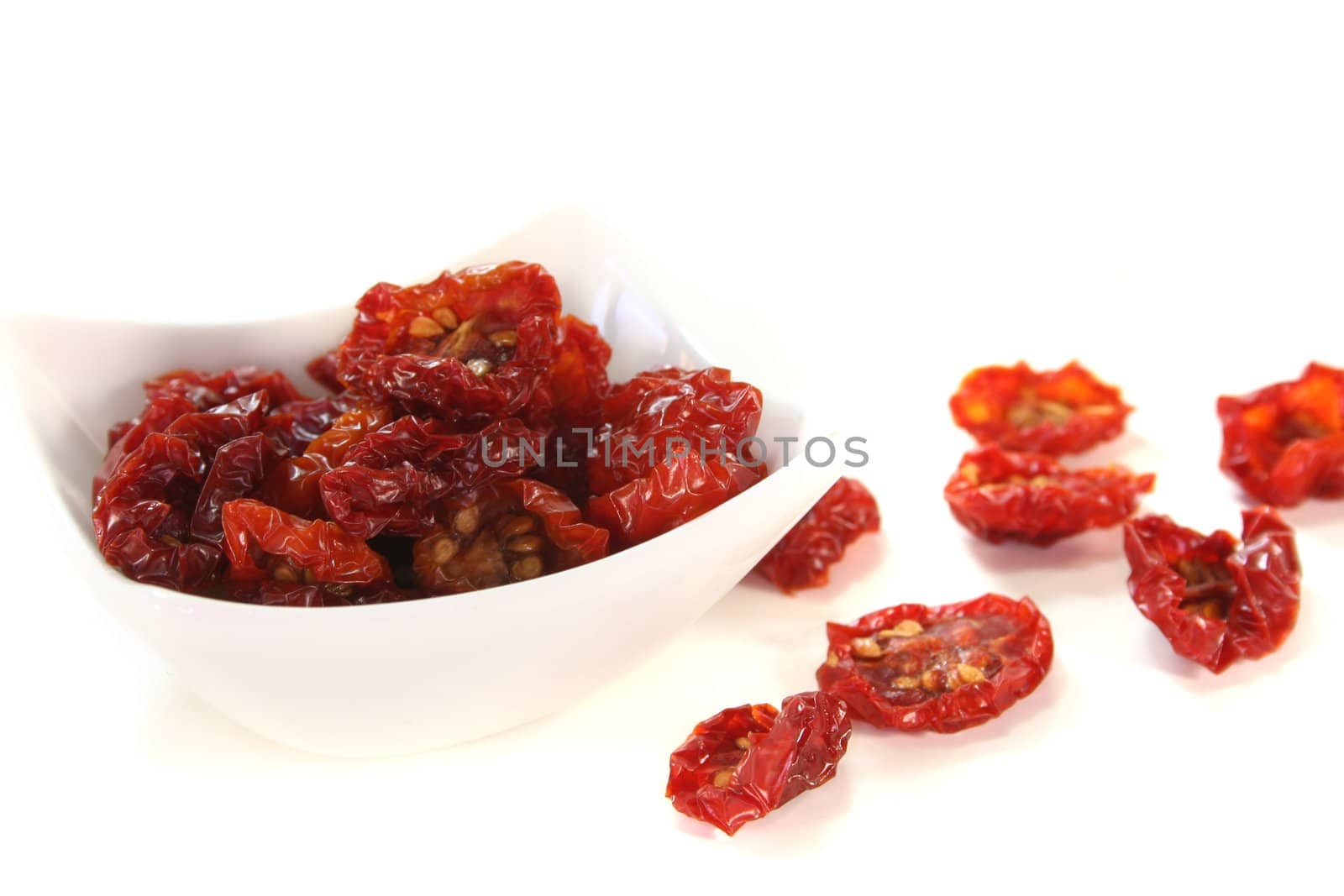 fresh dried tomatoes on a white background