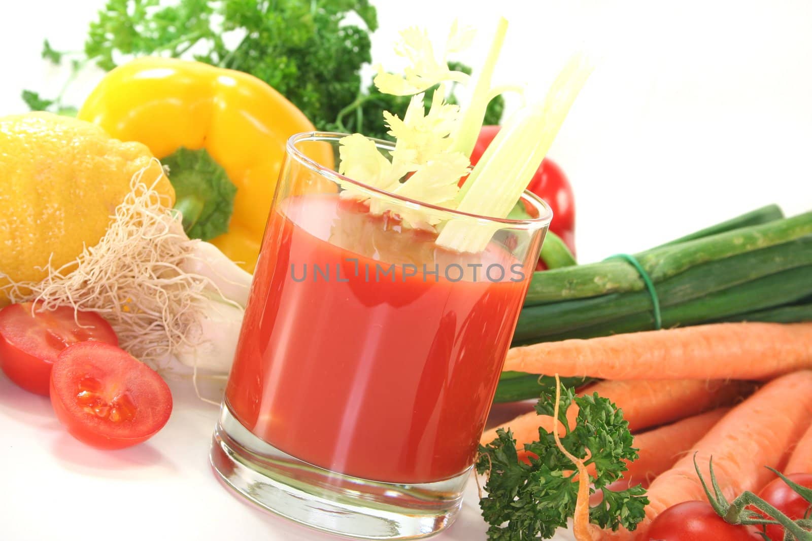 fresh vegetable juice with celery, fresh vegetables and parsley