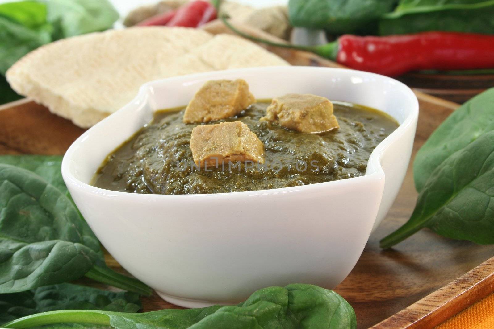 Indian Palak Paneer with rice and fresh ingredients