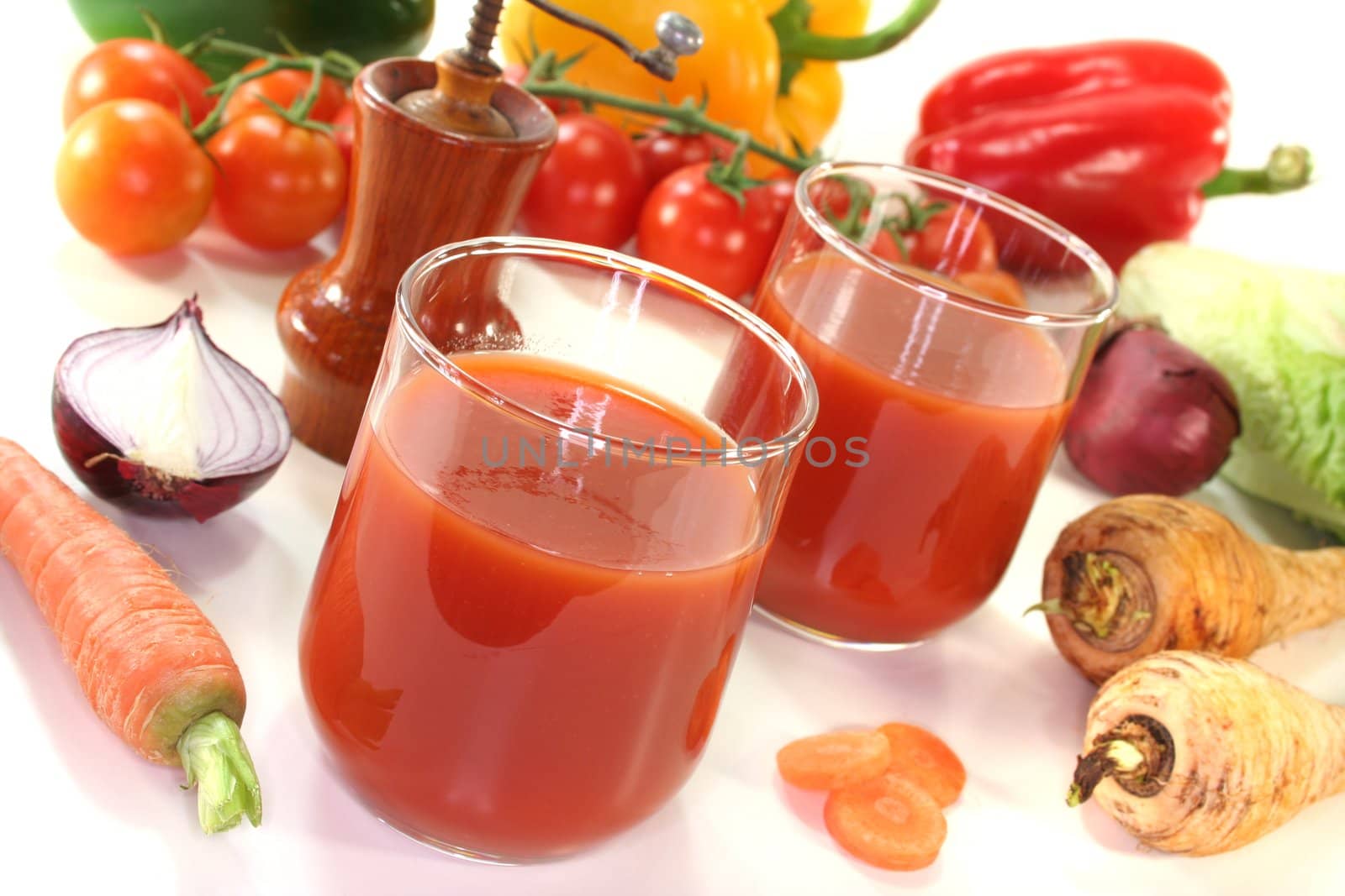 fresh vegetable juice with peppers, carrots and other fresh vegetables