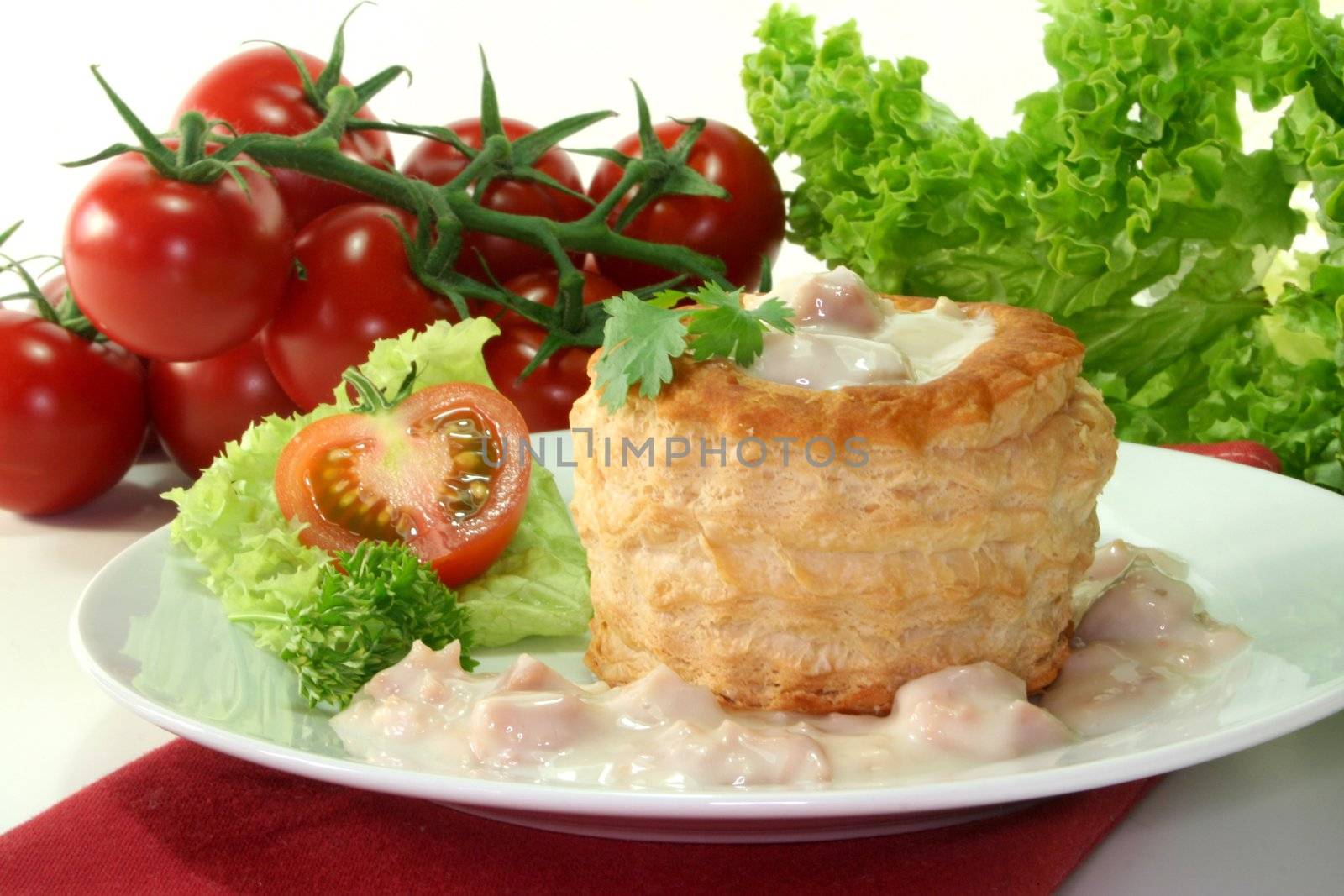Queen pie filled with meat sauce and fresh herbs