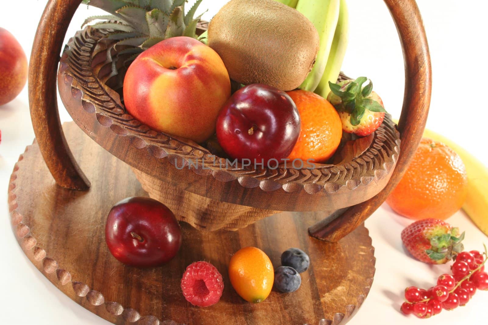 Mix of native and exotic fruits in a wooden basket